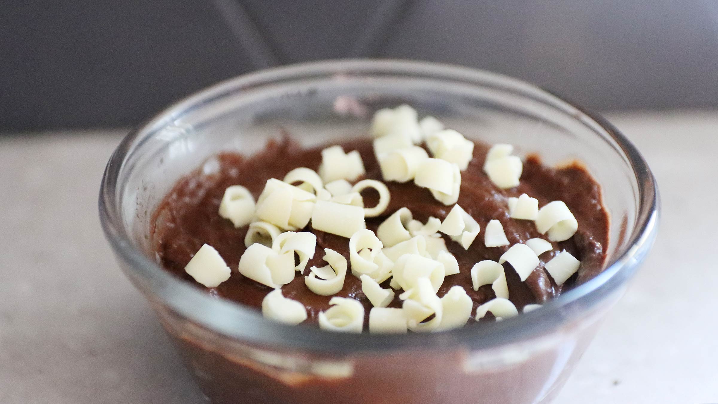 Chocolate pudding with shaved white chocolate