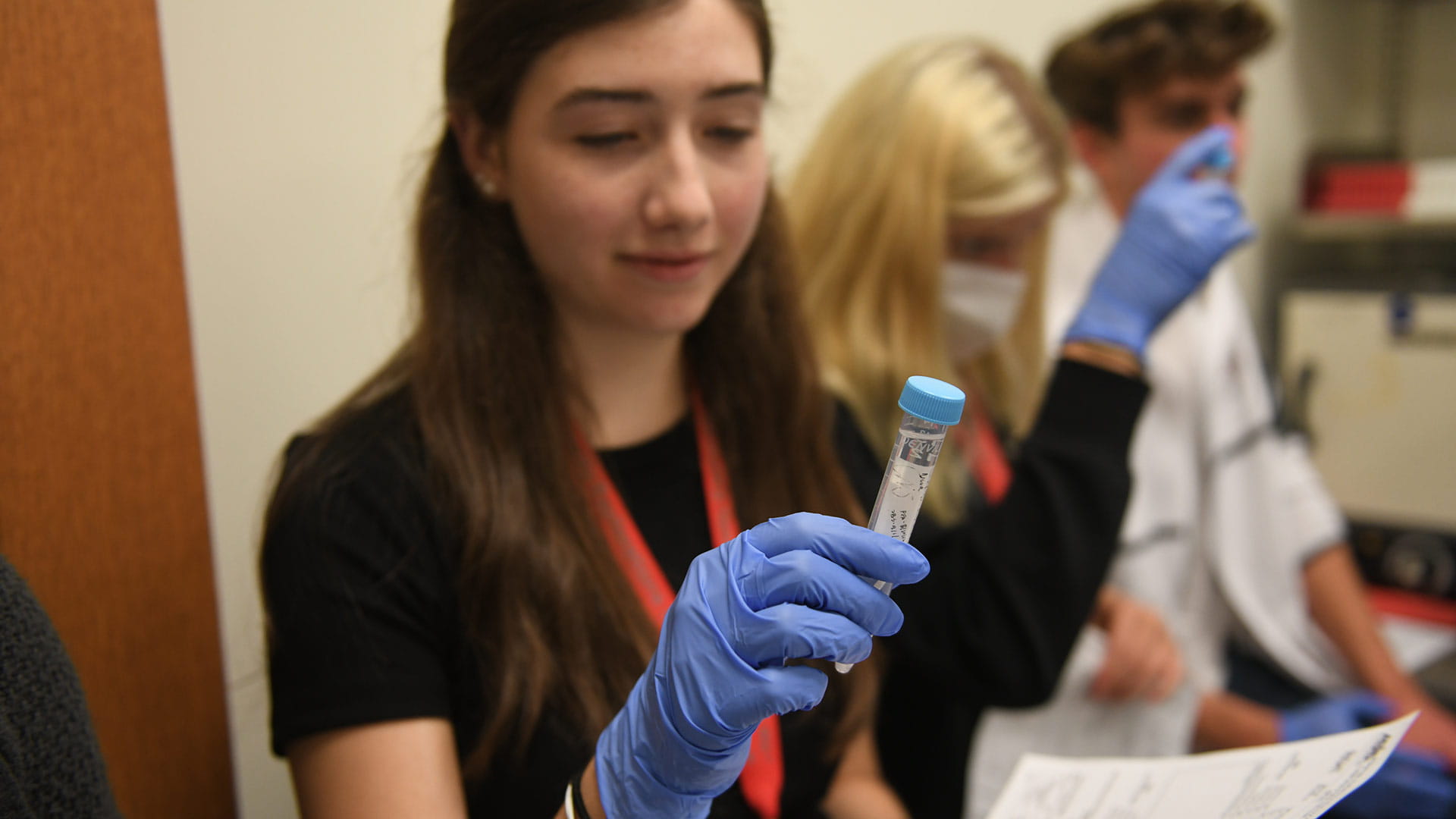 Girl holding a test tube