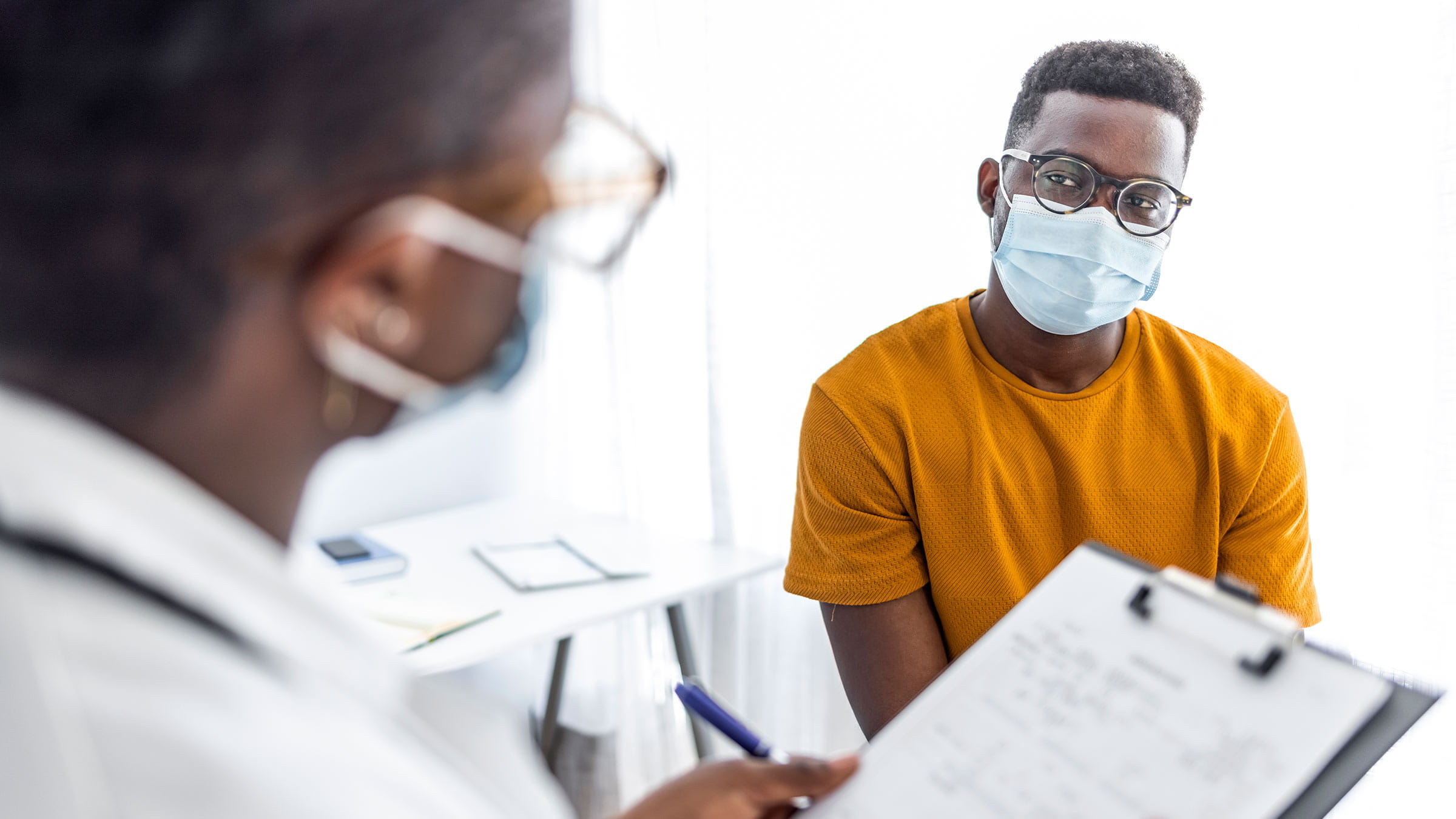 Doctor questioning patient at an appointment