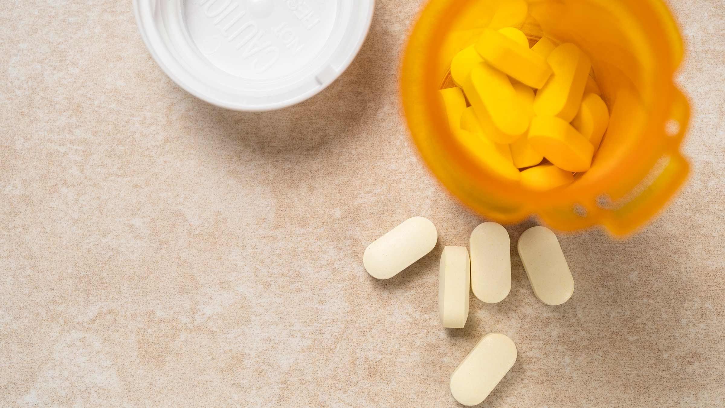 Overhead view of pills in prescription bottle