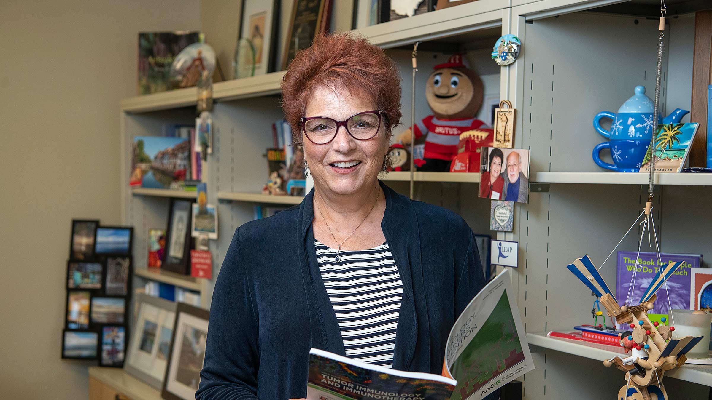 Dr. Paskett in her office smiling