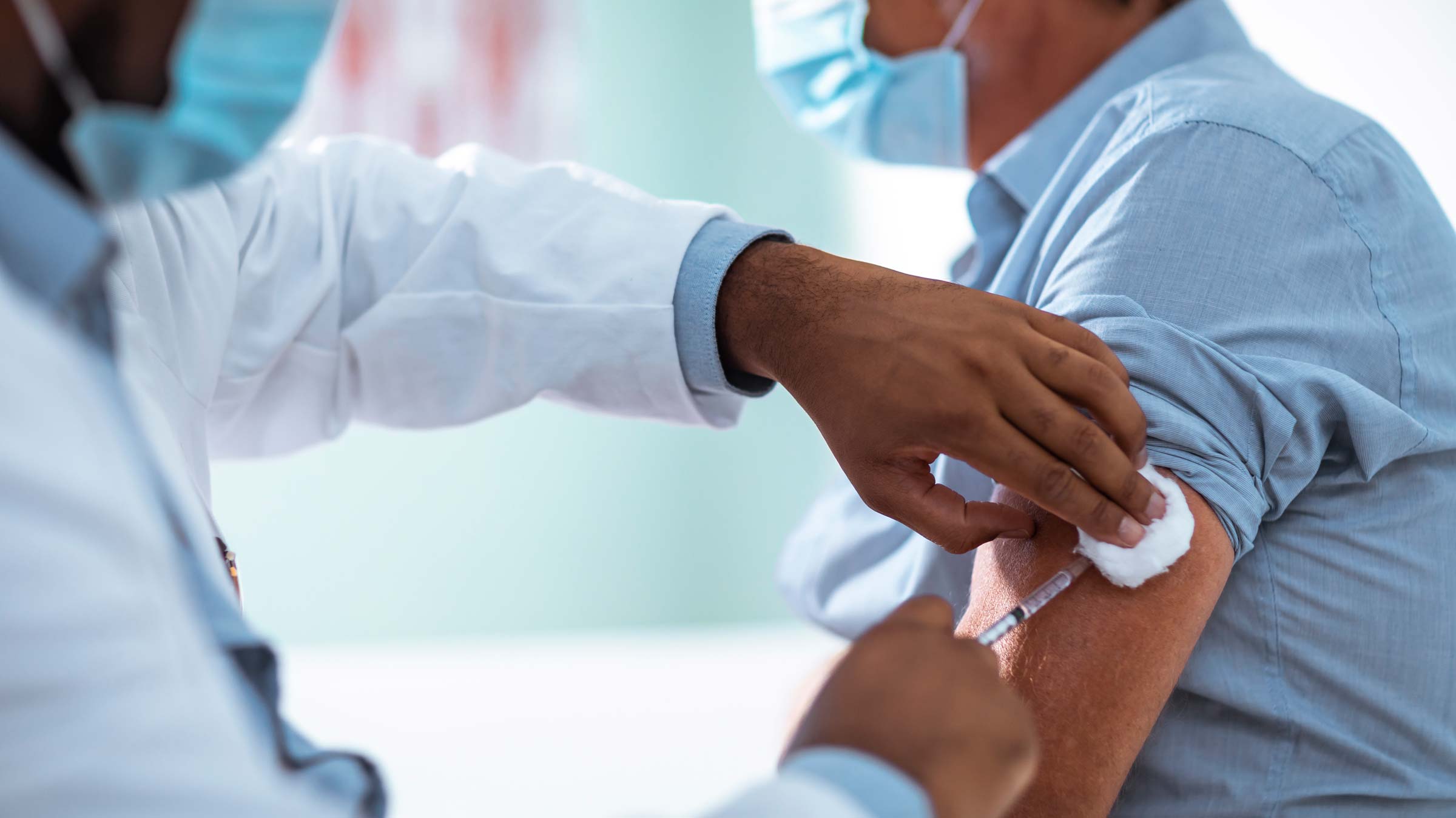 A man receiving his annual flu shot