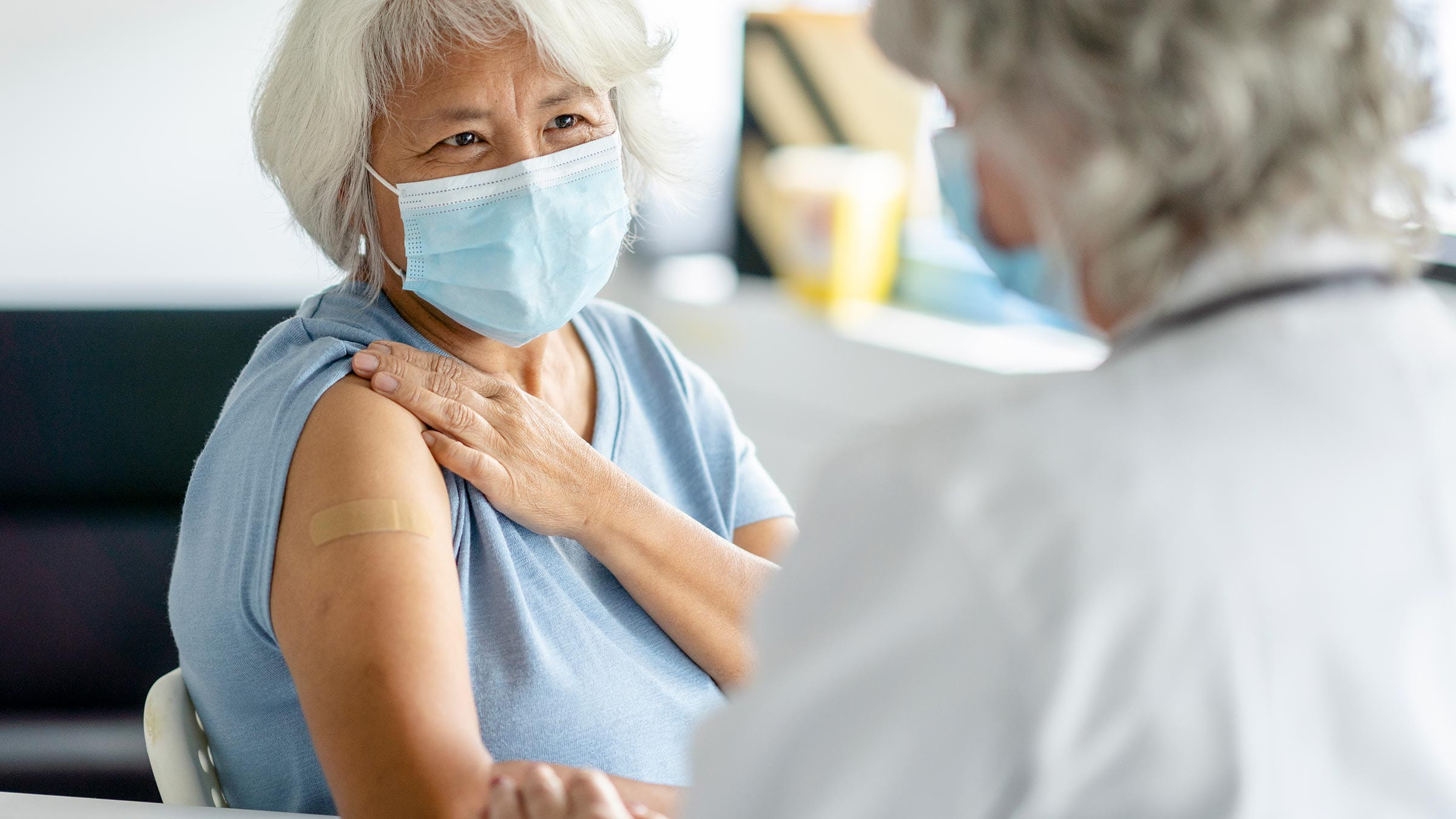 A senior patient gets the flu shot