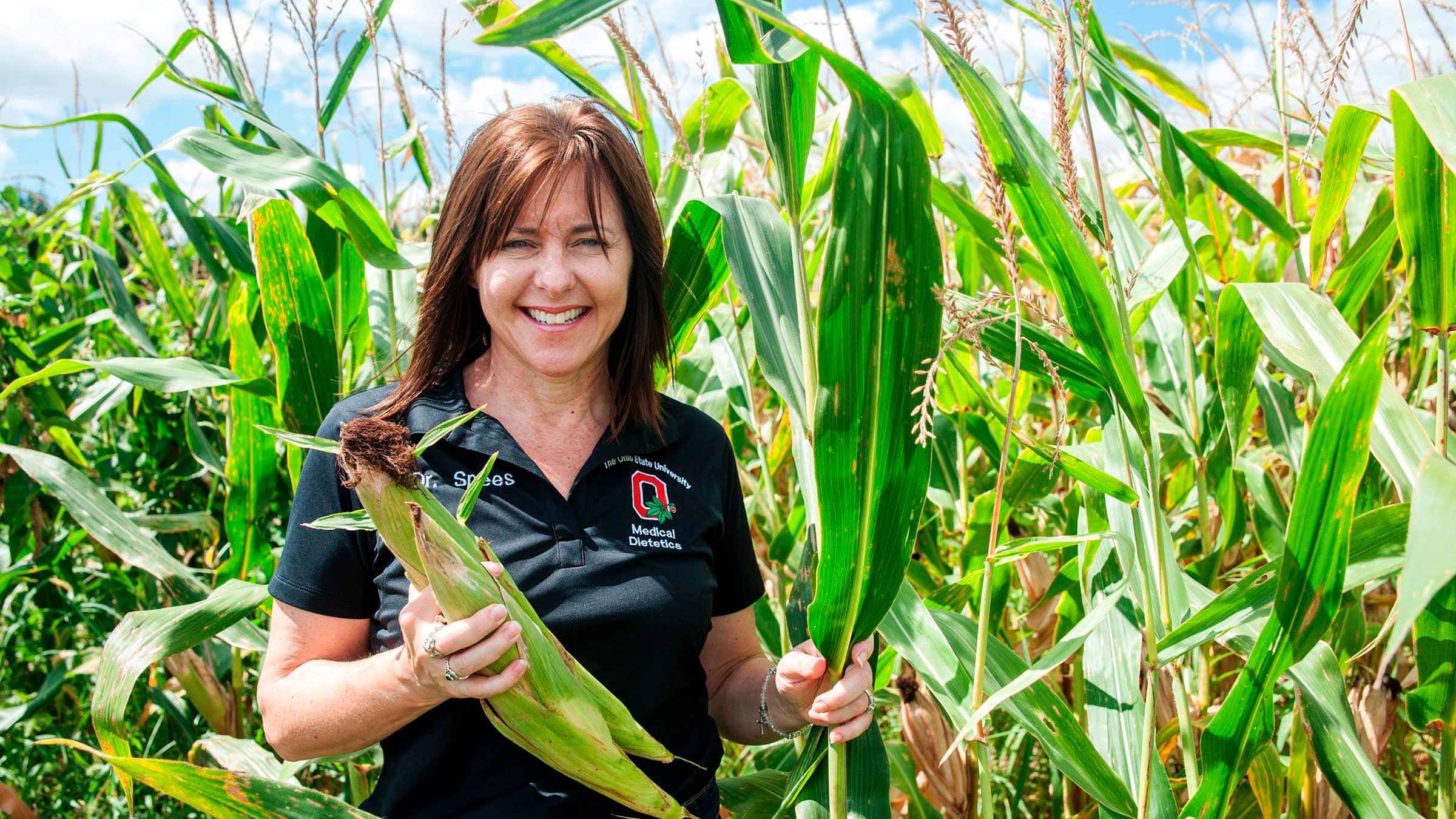 Dr. Spees harvesting corn