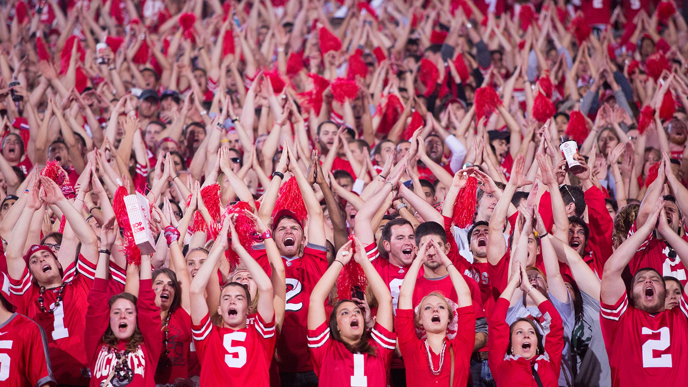 Ohio State football fans cheering in Ohio stadium