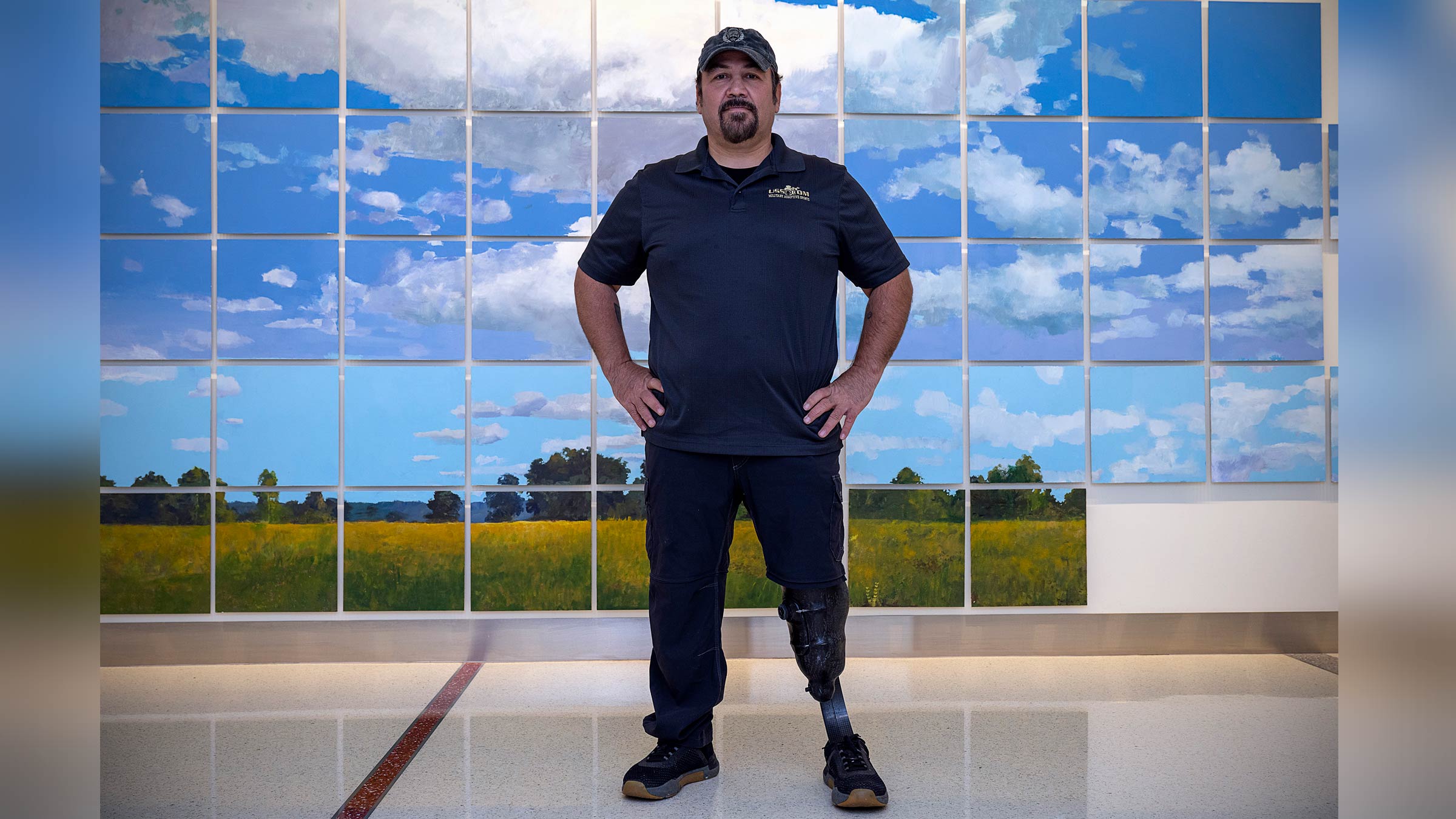 Shane Jernigan standing in a hallway wearing his prosthetic leg