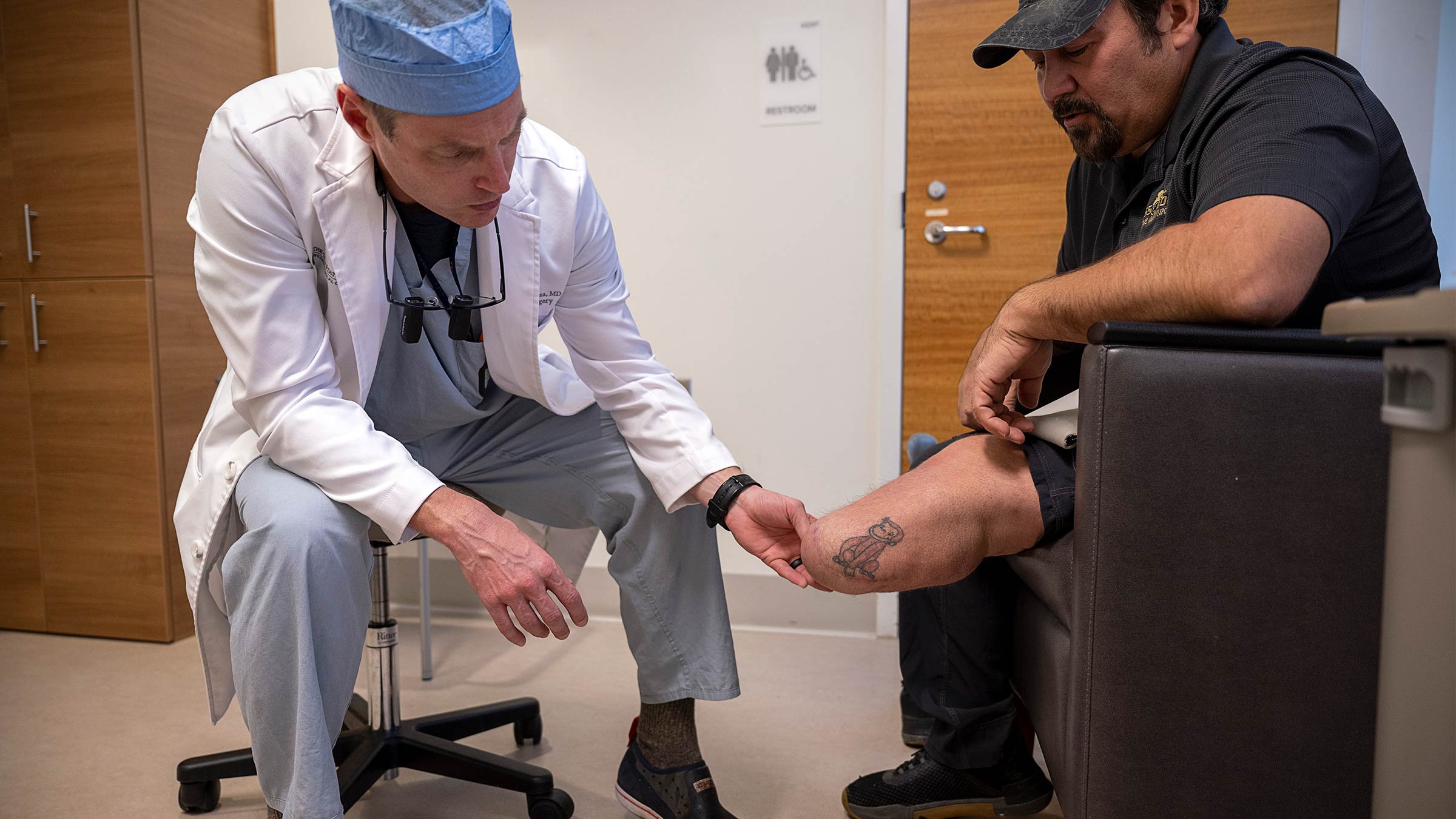 Dr. Souza examining Jernigan's limb