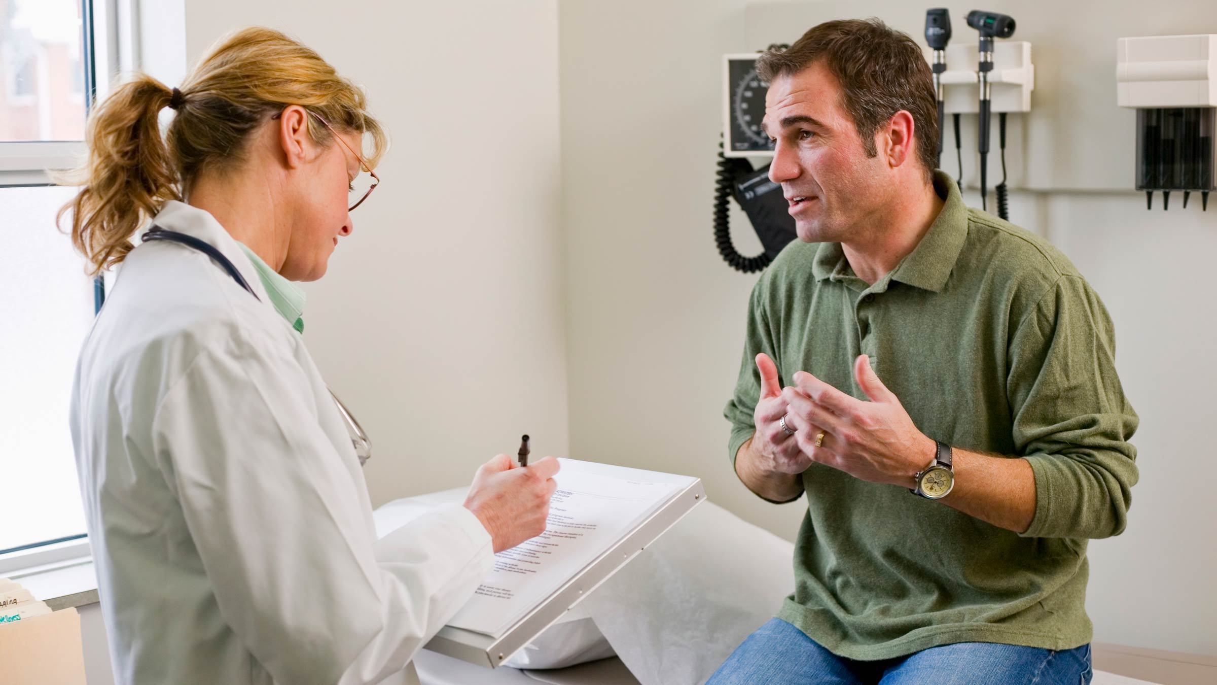 Male patient talking with a doctor