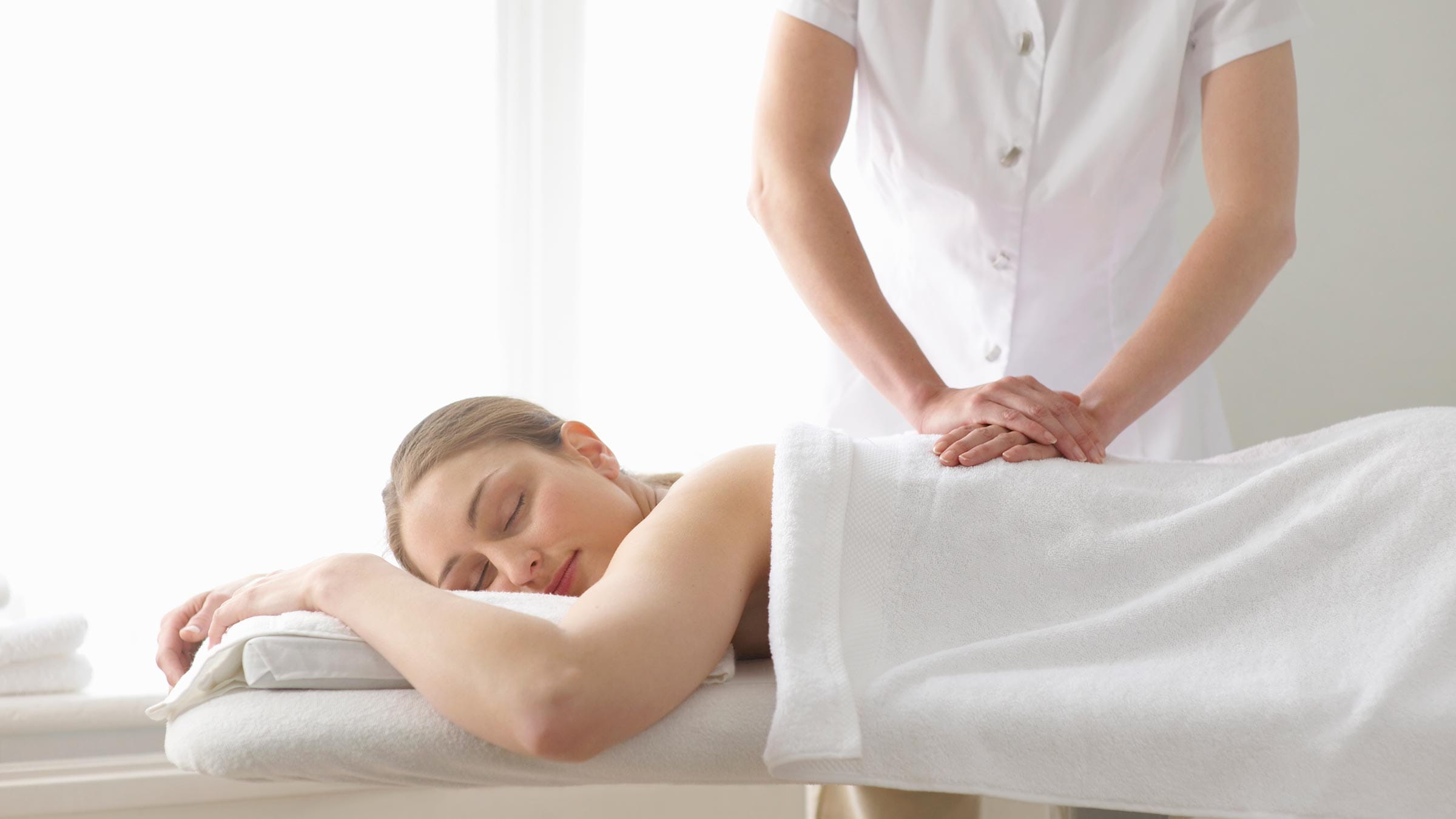 A woman receives a therapeutic massage