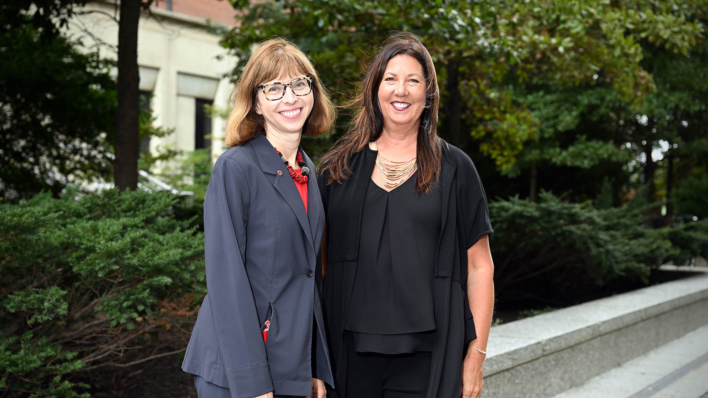 Jackie Hoying, PhD, RN, standing with a colleague on Ohio State Medical Center campus
