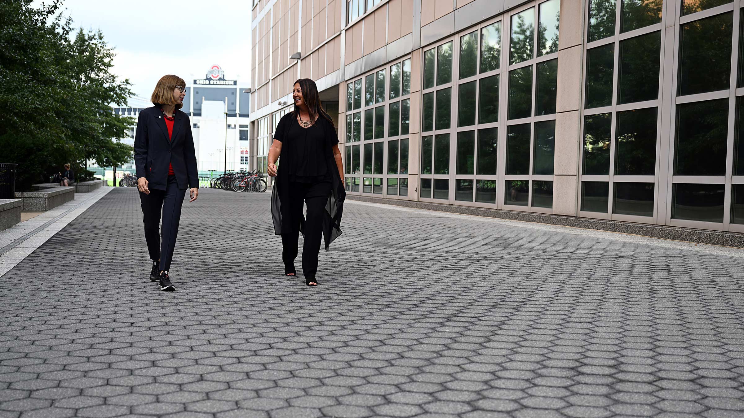 Dr. Jackie Hoying walking with Dr. Inga Zadvinskis on Ohio State campus