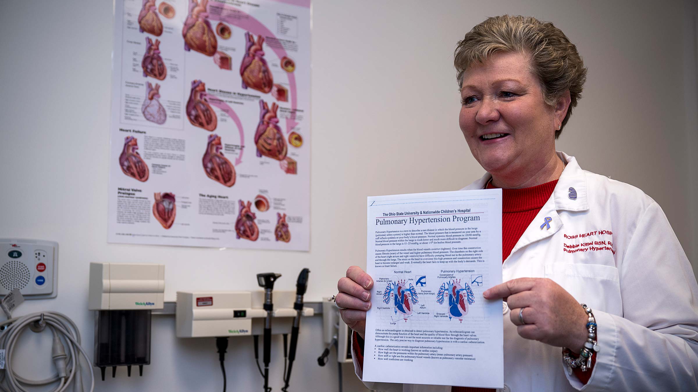 Nurse Debbie Kittel, BSN, RN, CCRN, holding a flyer for Ohio State’s pulmonary hypertension program