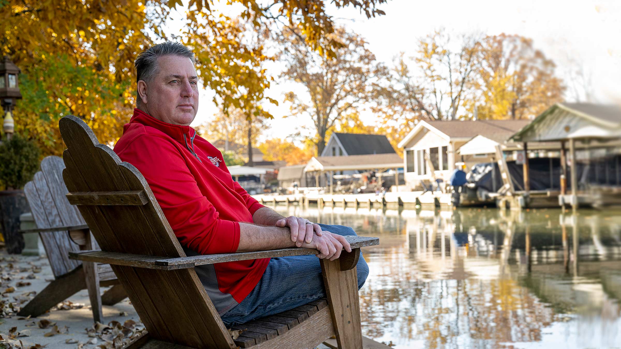 Duane Gross sitting by a lake