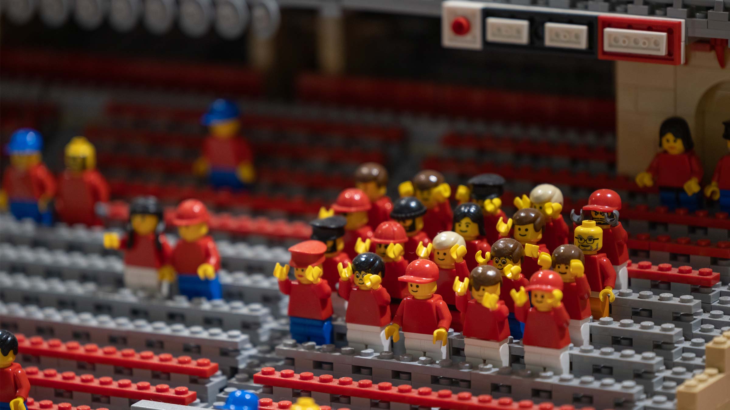 Lego figurines cheering in the Lego replica of Ohio Stadium