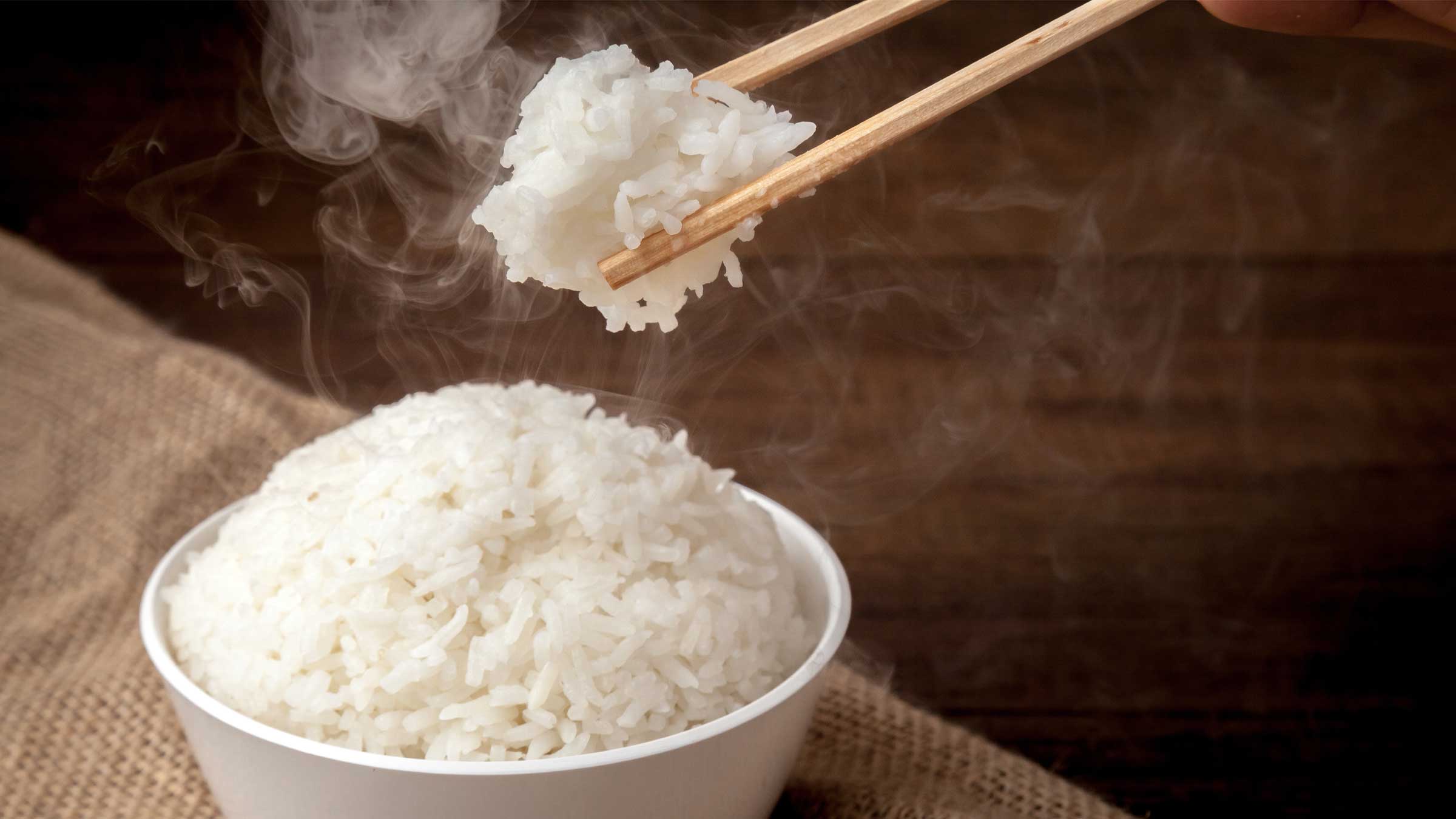 Steaming bowl of white rice.