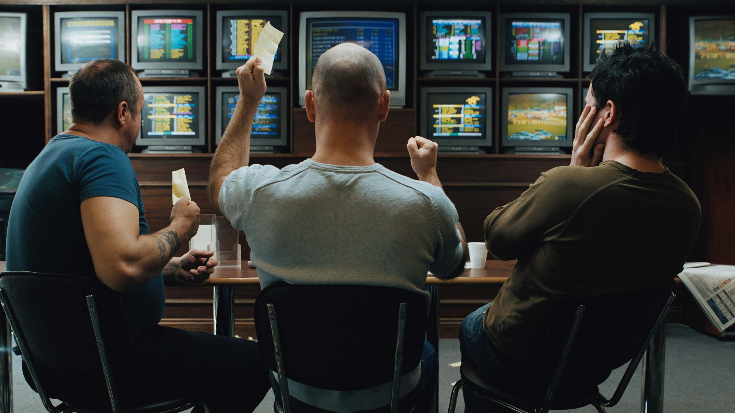 Three men gambling on sports
