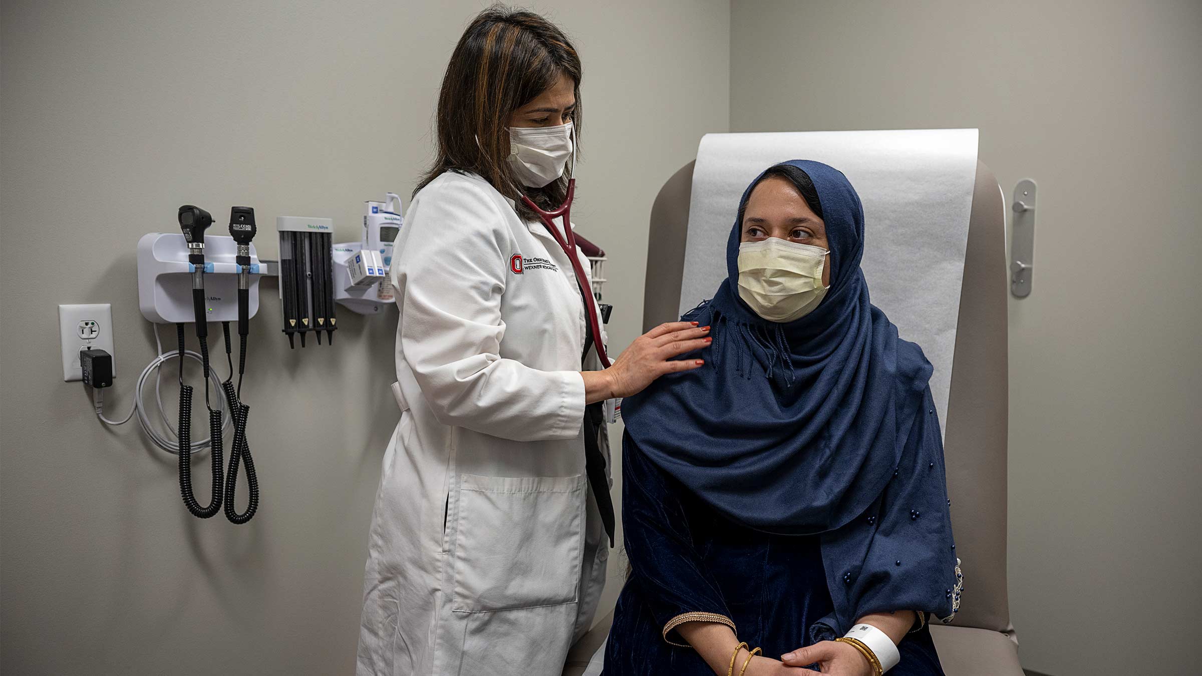 Multilingual doctor, Taru Saigal, MD, meets with a patient with limited English proficiency.