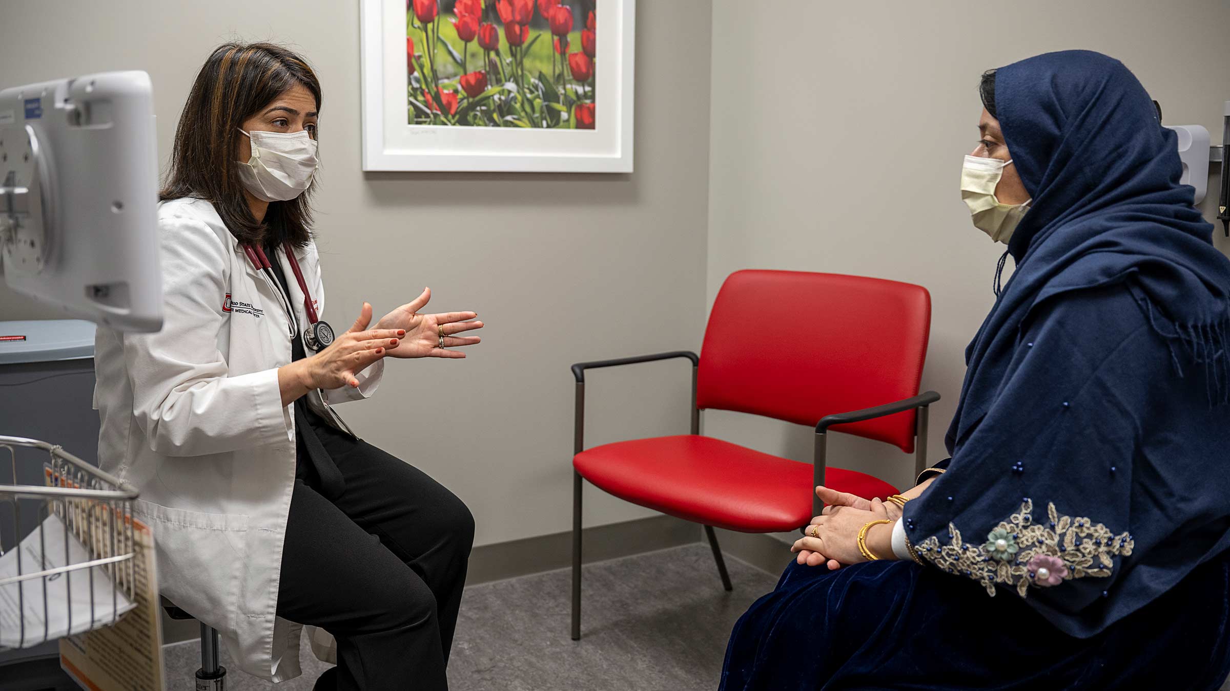 Multilingual doctor, Taru Saigal, MD, meets with a patient with limited English proficiency.