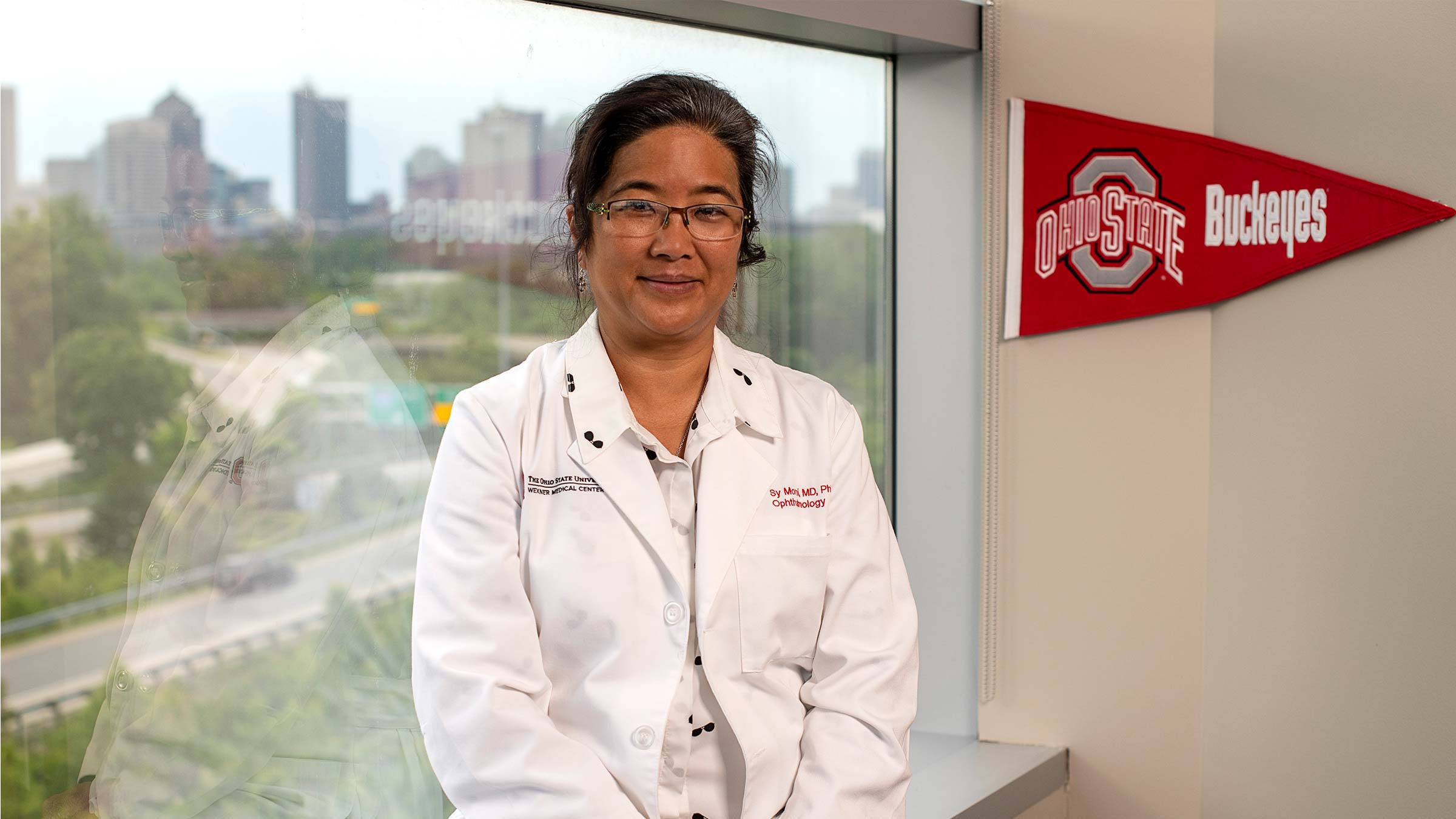 Dr. Moroi standing in her office at the Ohio State Eye and Ear Institute