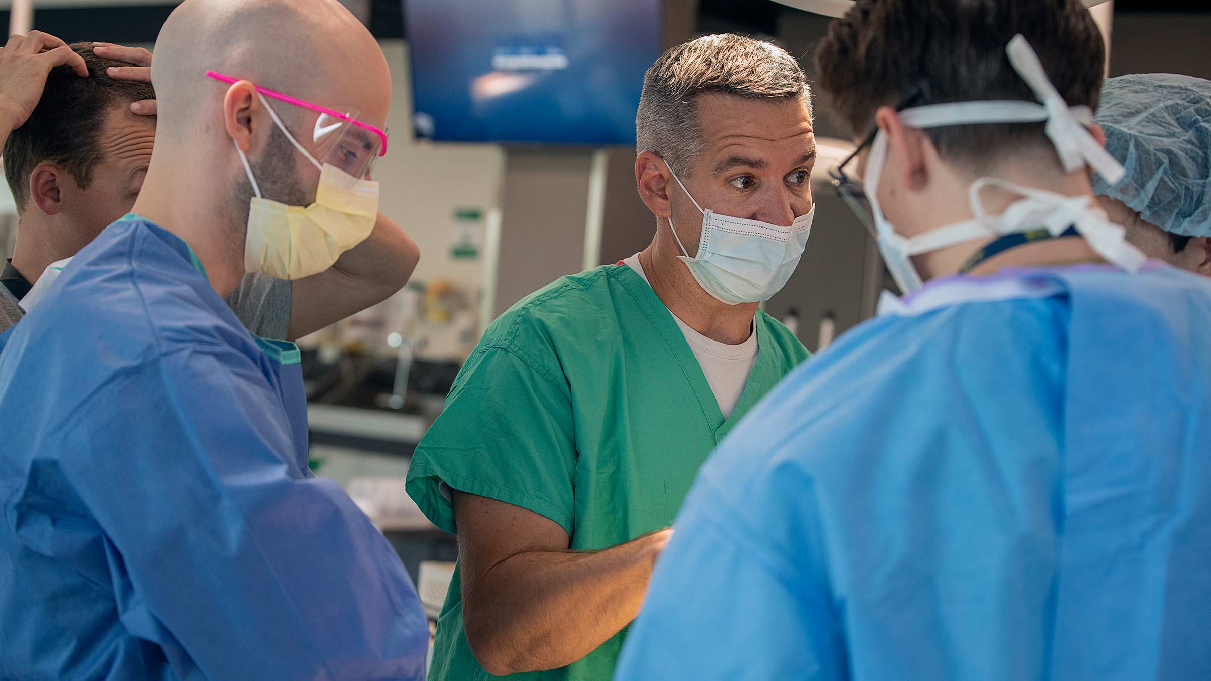 Thomas Scharschmidt, MD, orthopedic oncologist, assists third-year residents in the Surgical Skills Lab
