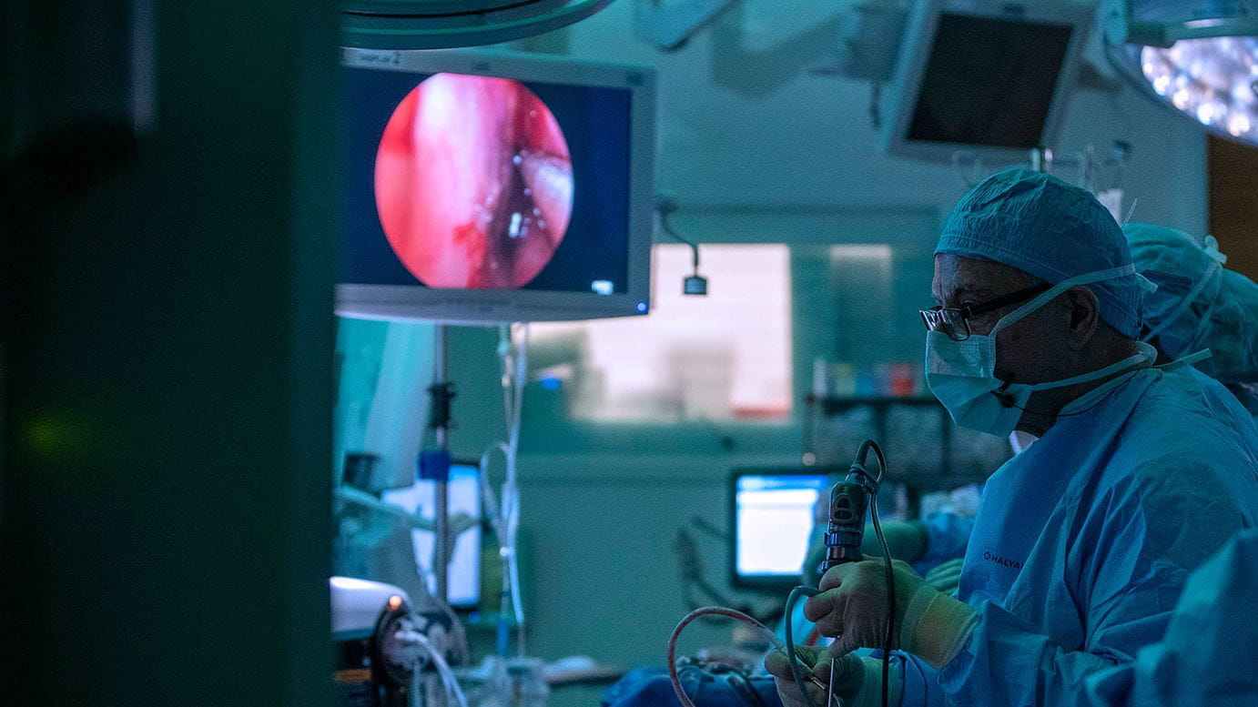 Ricardo Carrau, MD, an otolaryngologist-head and neck surgeon at Ohio State, operating on a patient