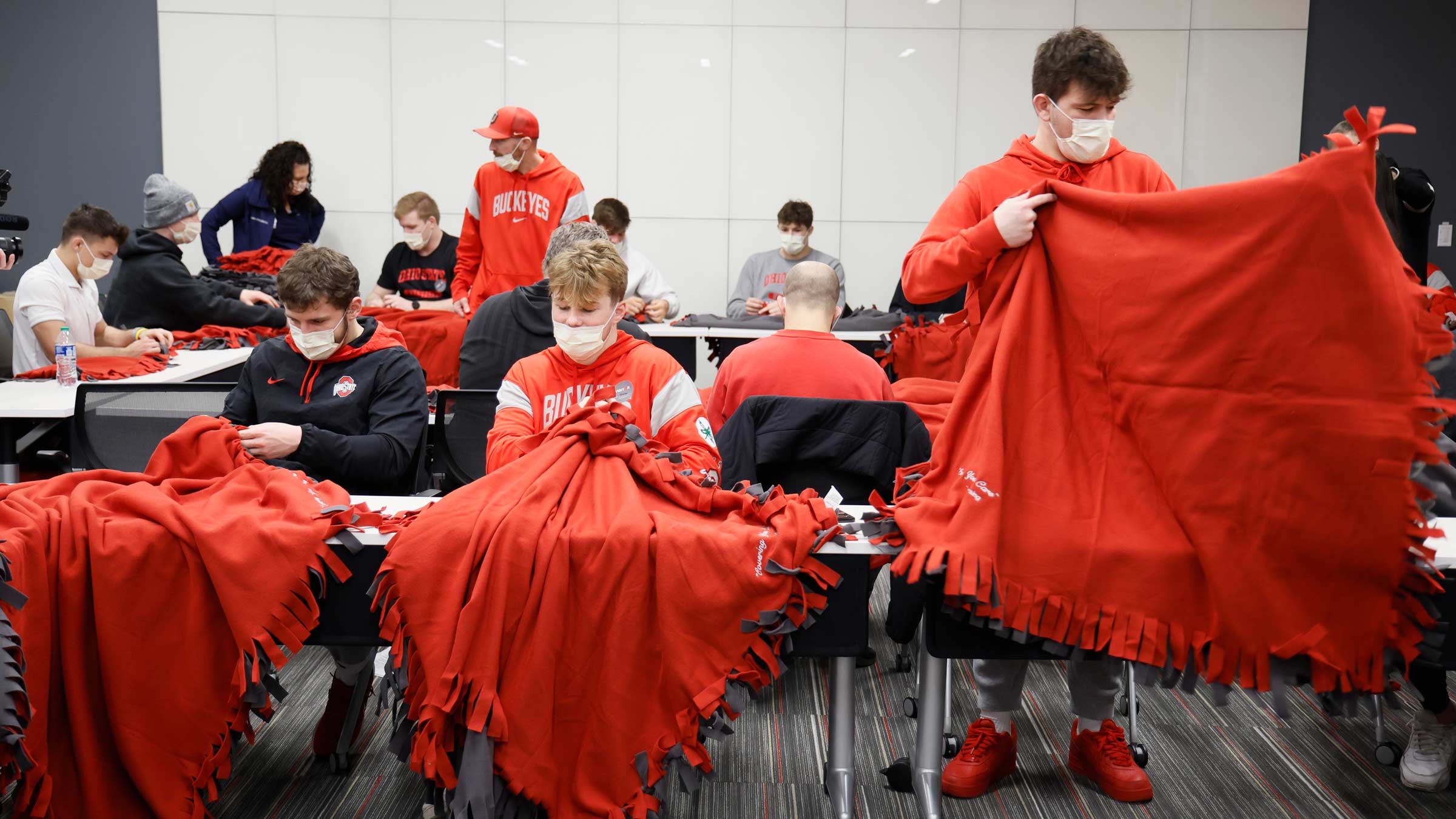 Nic Bouzakis was joined by nearly 30 members of The Ohio State University wrestling team to make blankets.
