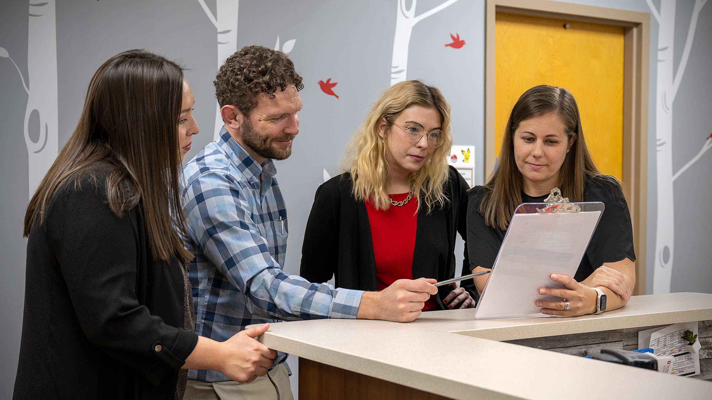 CAST’s Medical Director Christopher Hanks, MD, consults with members of the team who treat adults on the autism spectrum.