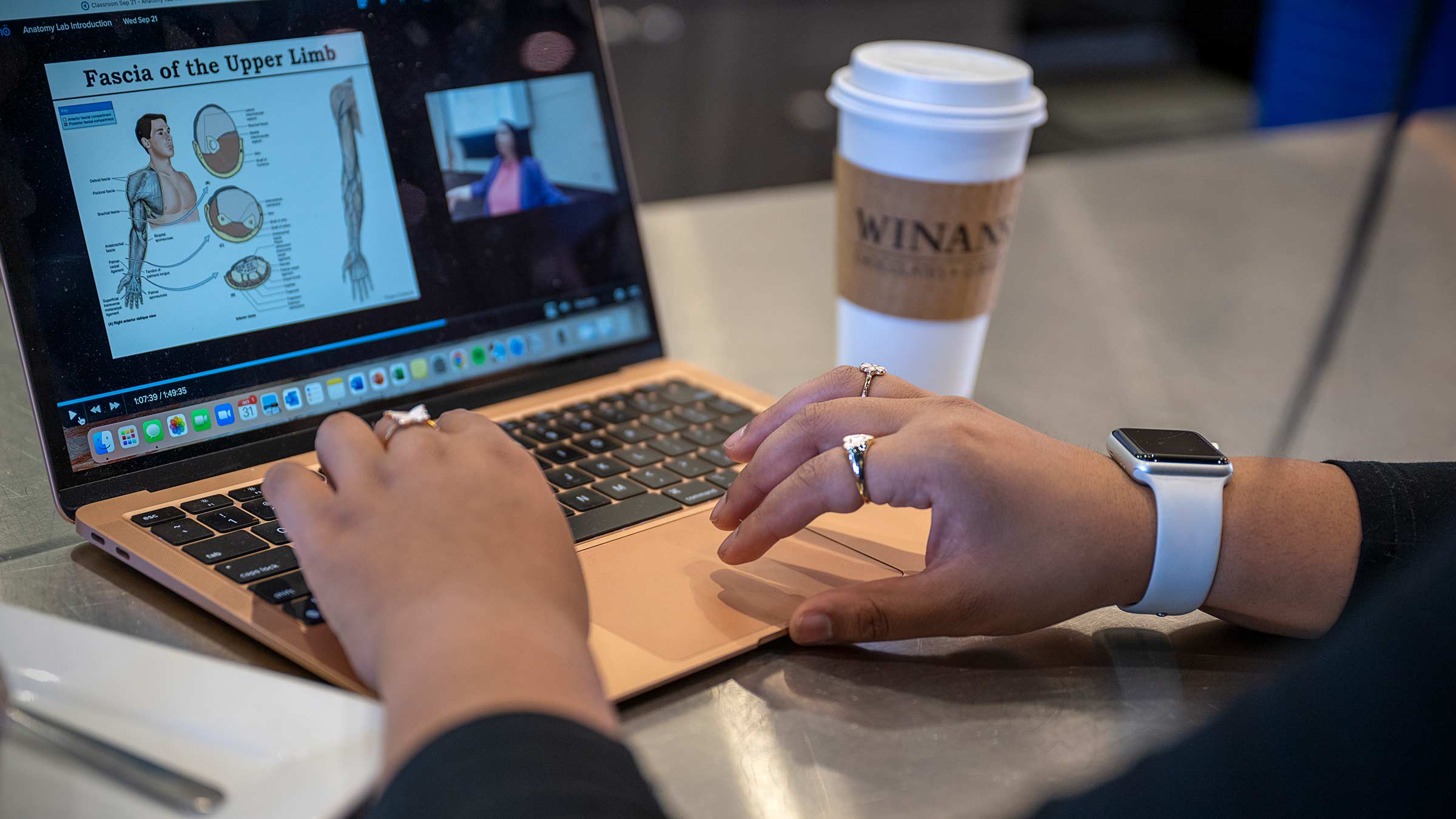 Medical student, Varshita Chirumamilla, reviews lecture material on her laptop