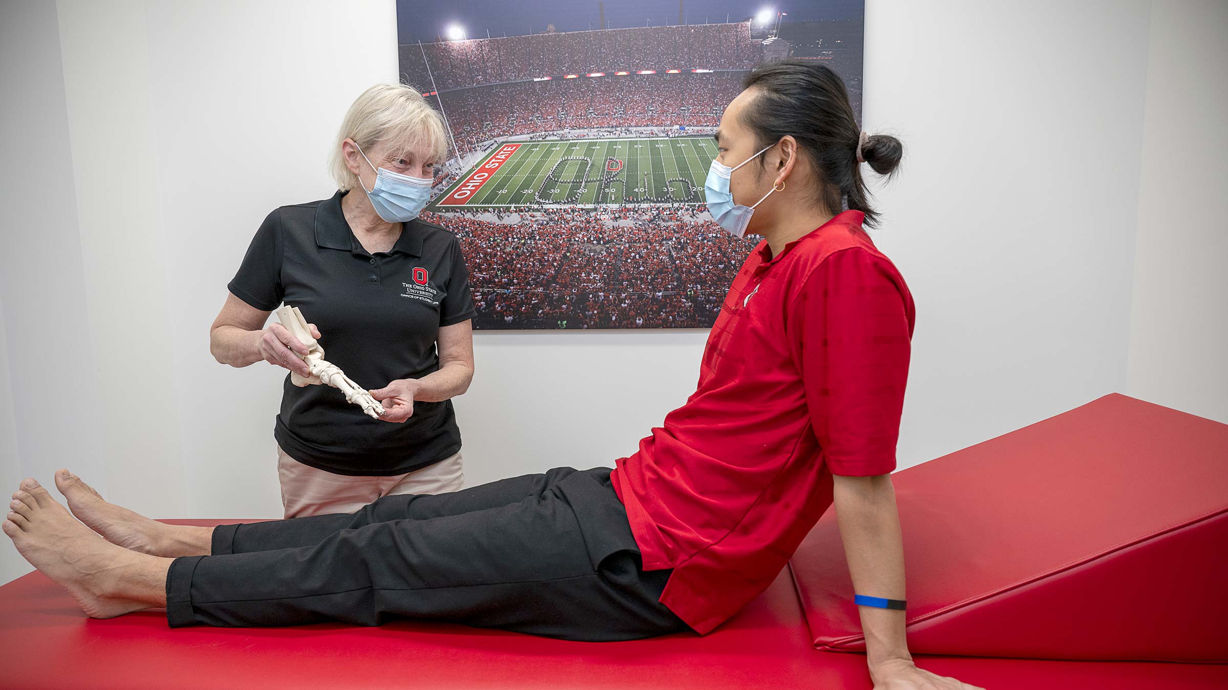 Physical therapist and heart attack survivor, Pamela Bork, with a patient