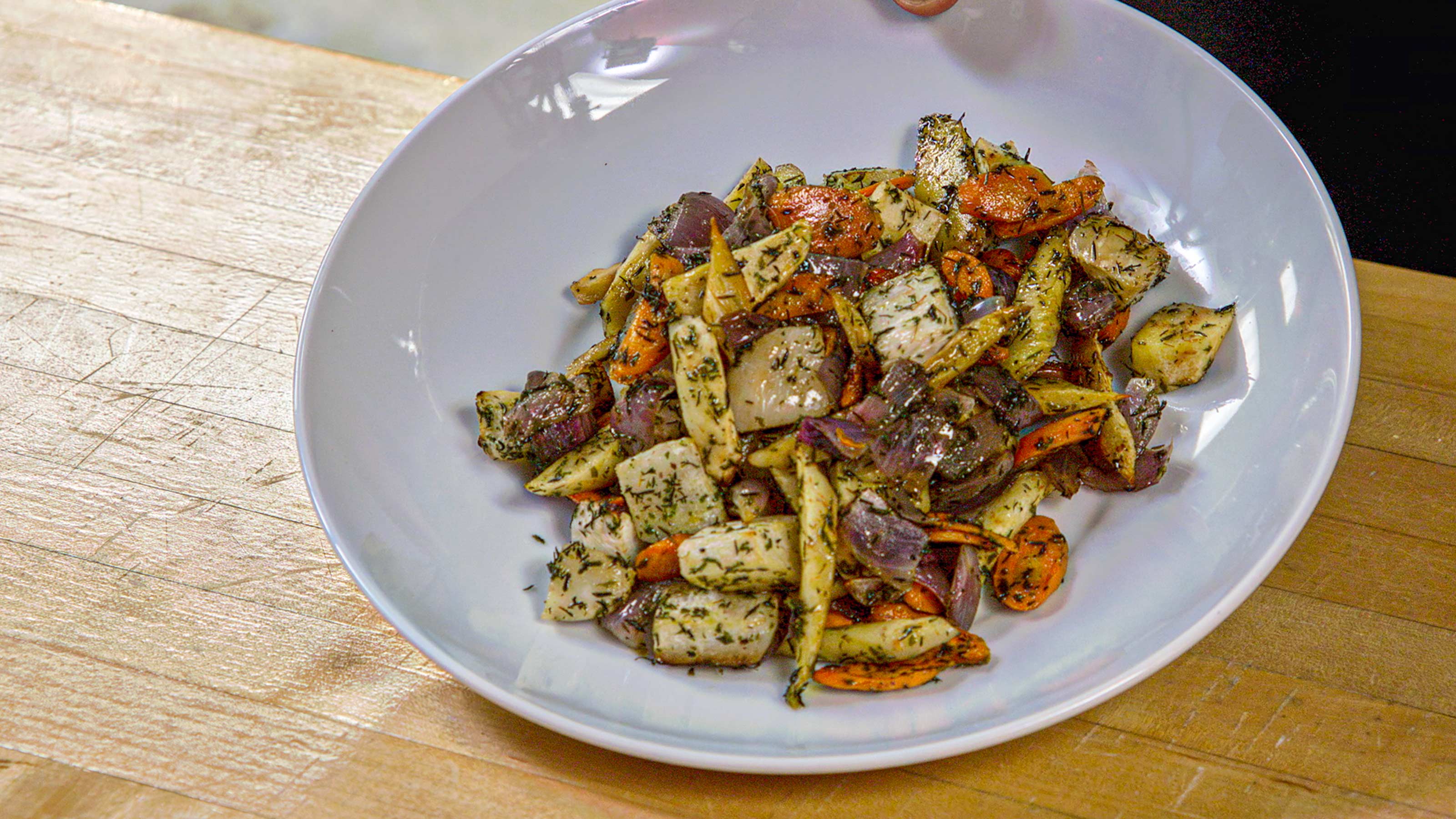 Herb-roasted root vegetables on a plate