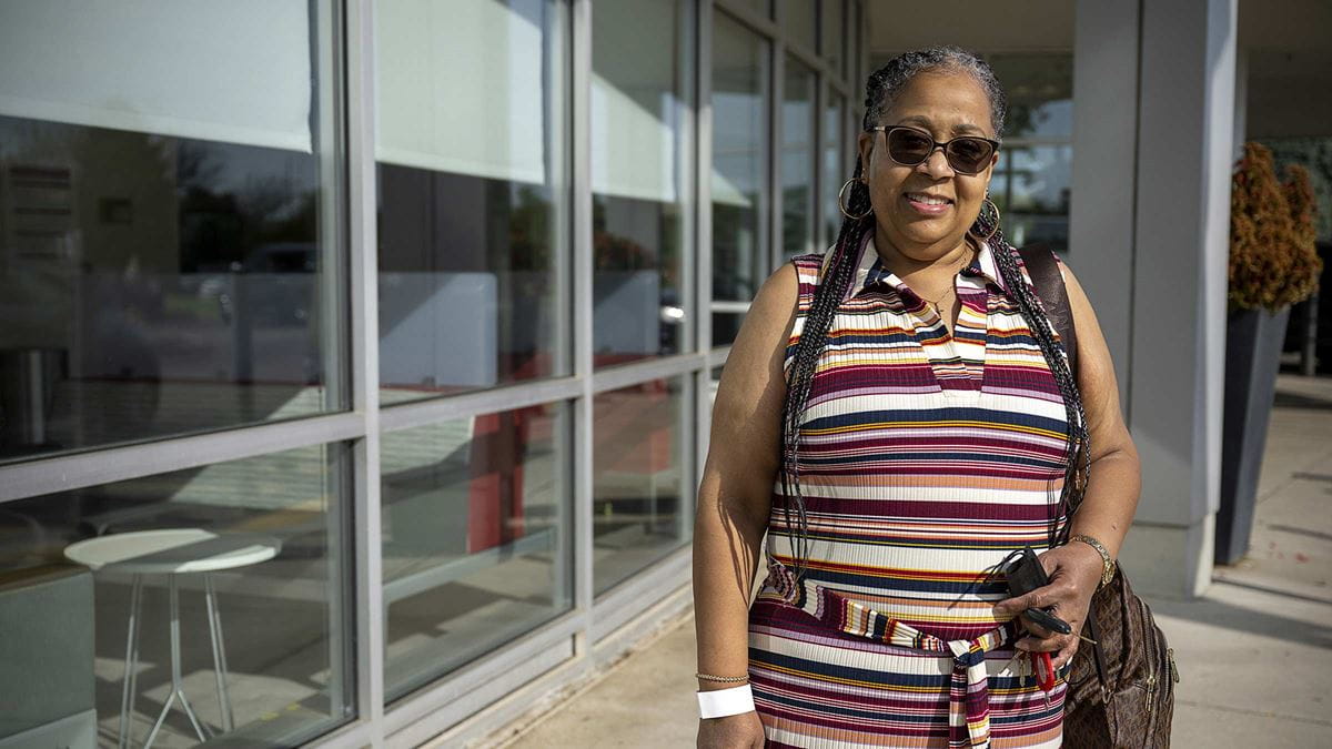 Patient April Muldrow standing outside of the hospital