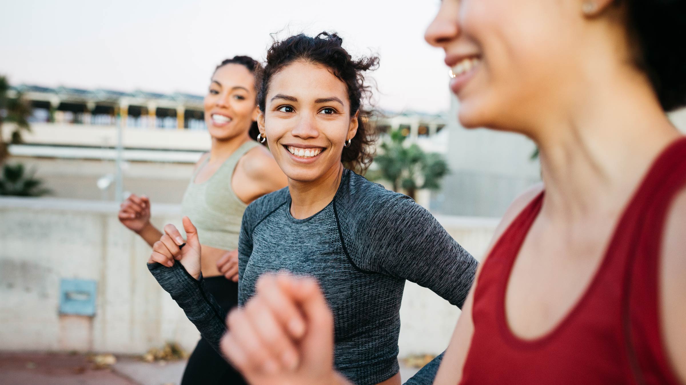 Group of young women running outside