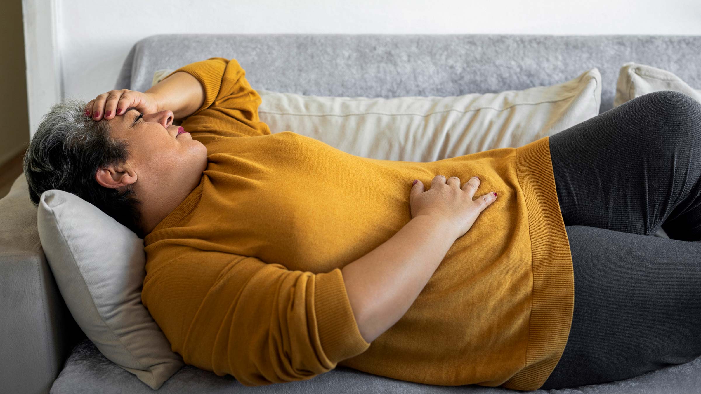 Woman holding stomach