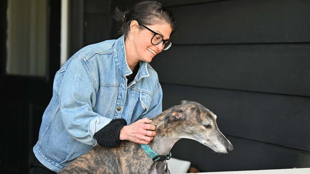 Sarah petting her dog