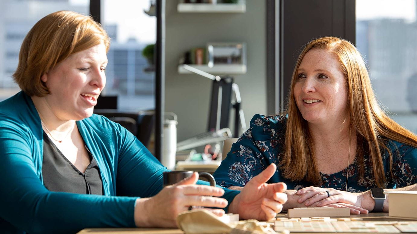 Carmen Quatman, MD, PhD, (left) and her twin sister, Katie Quatman-Yates, DPT, PhD, at Carmen’s home in Columbus.
