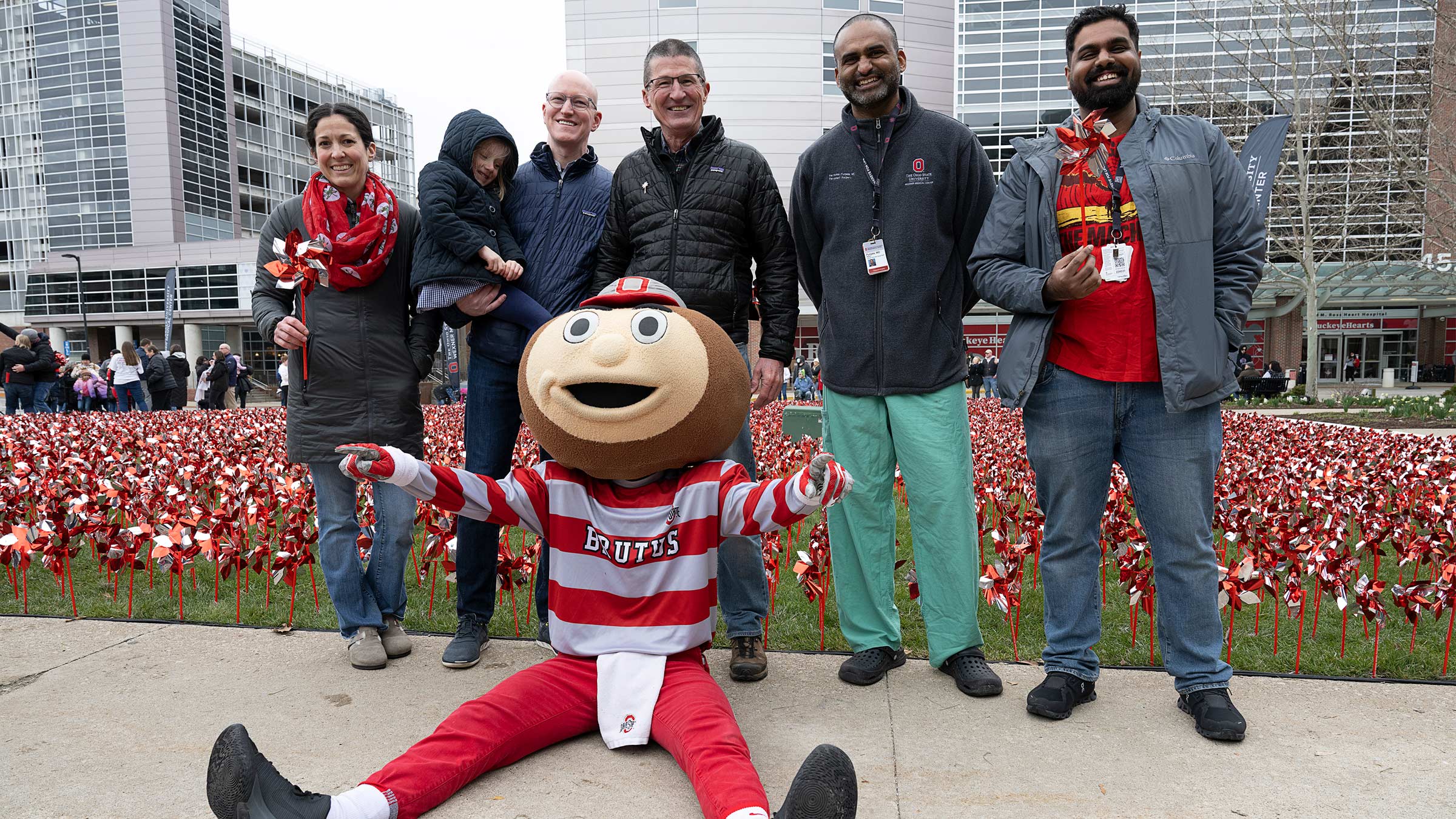 Dr. Washburn and other medical center staff standing with Brutus