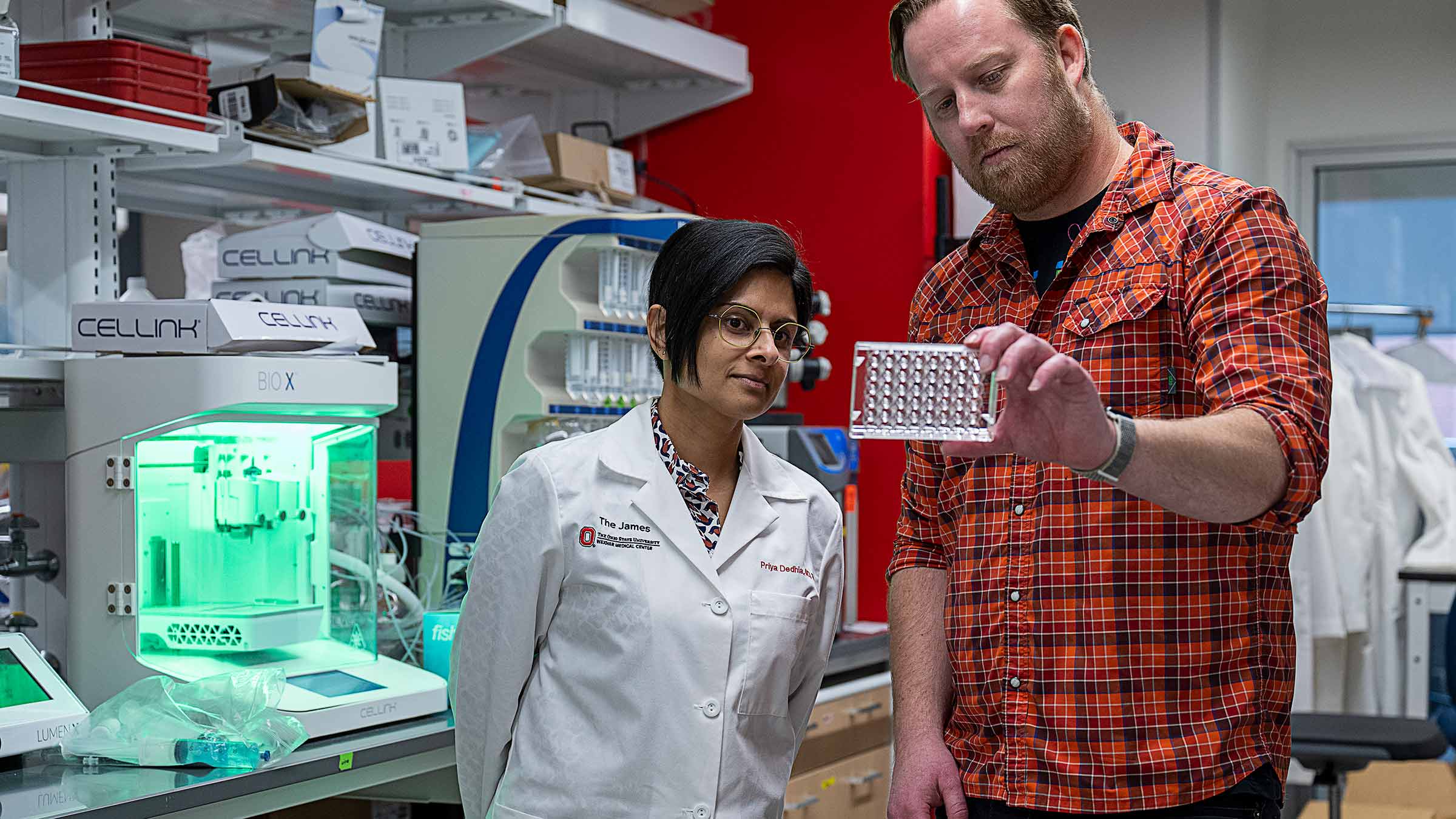 Doctors looking at a sample in a lab