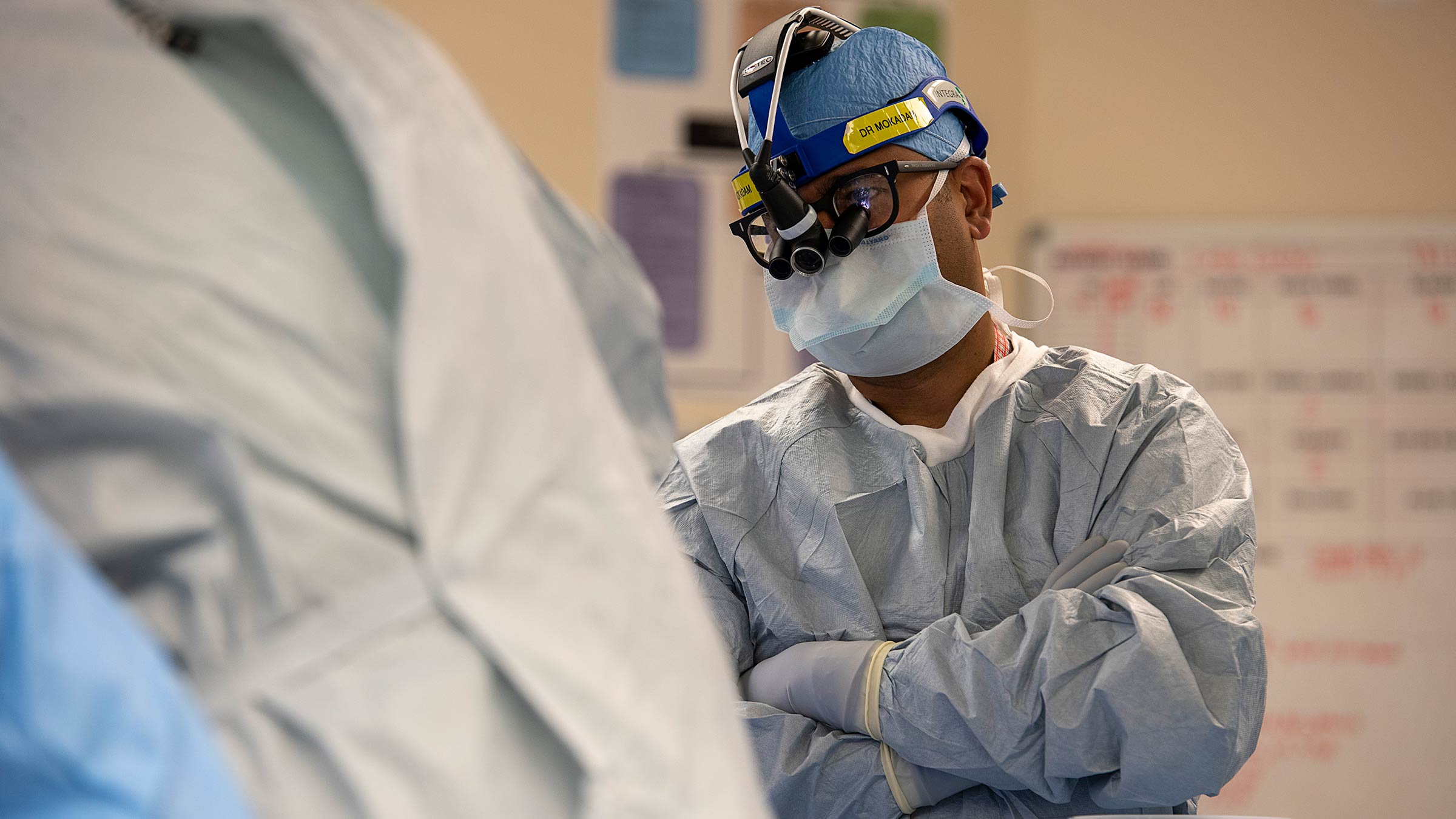 Nahush Mokadam, MD, wearing goggles and a mask in the operating room