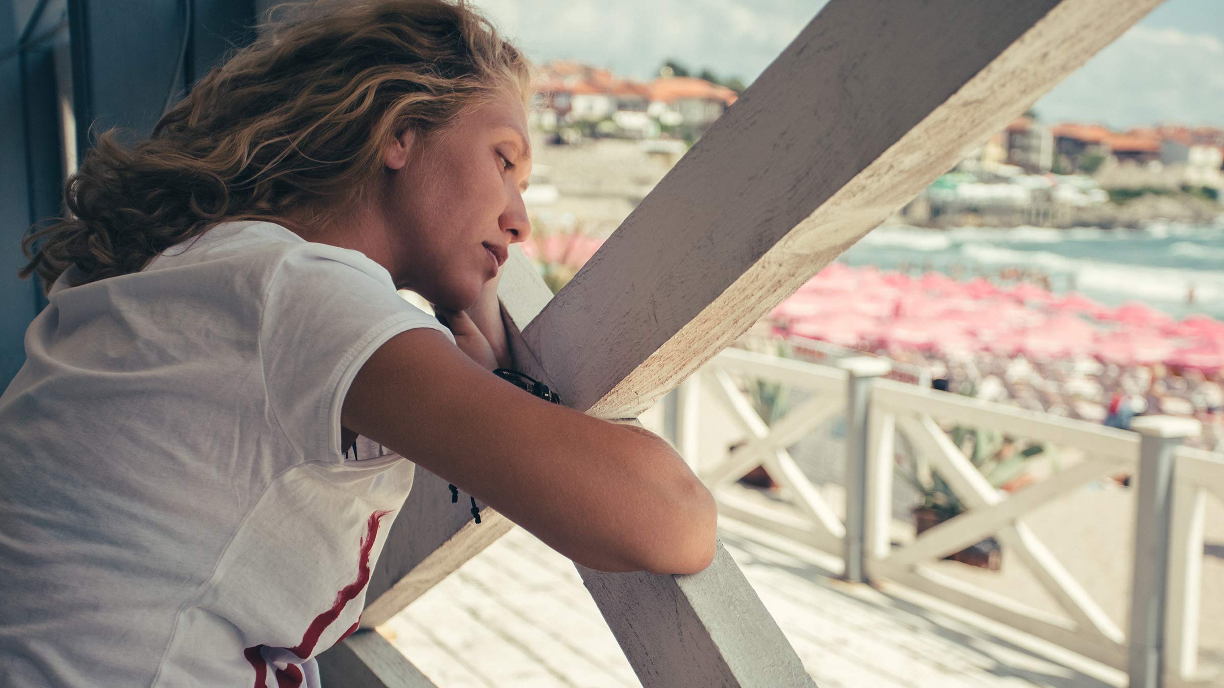 A woman experiencing seasonal depression at the beach