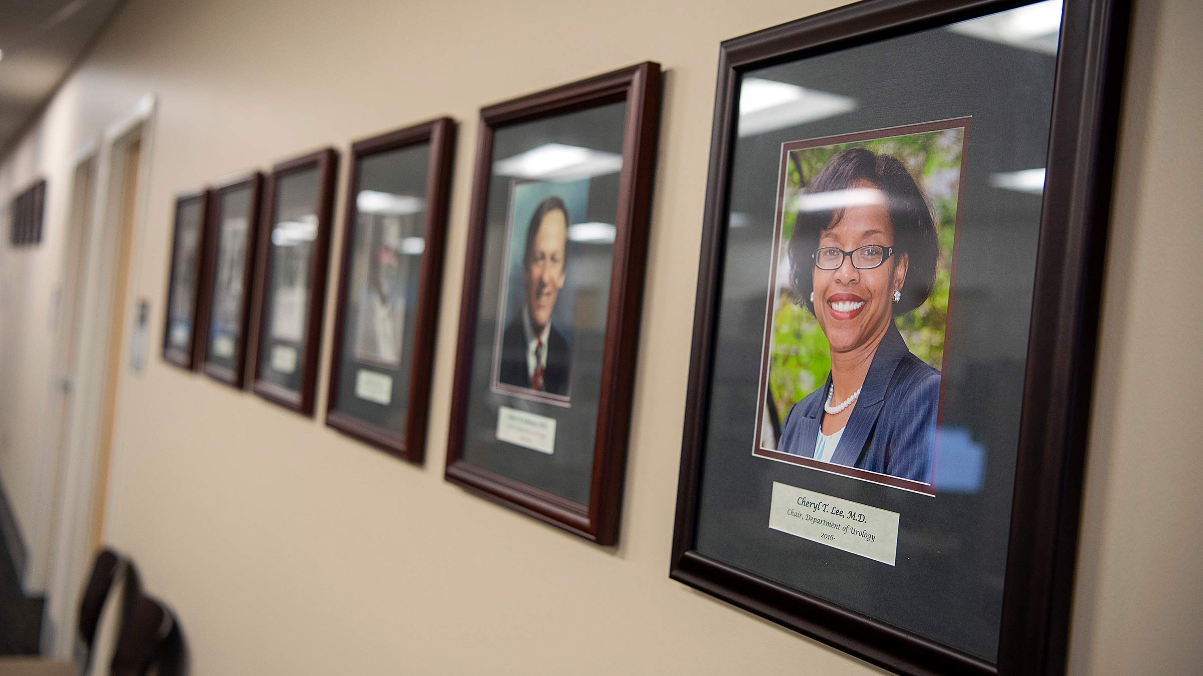 Portraits of the past leaders of the Urology department hung on a wall