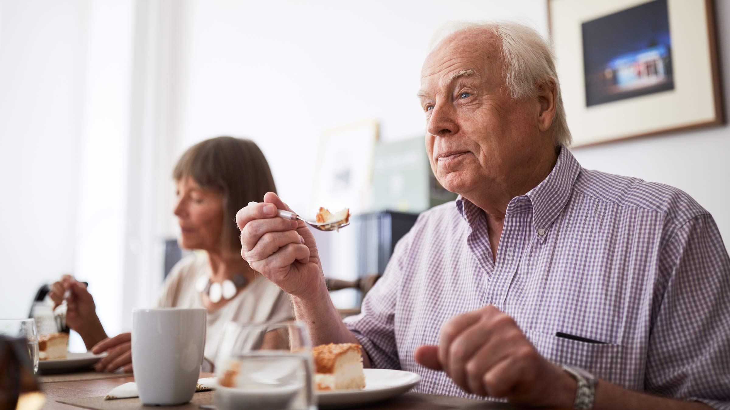 A man eating at a dinner table