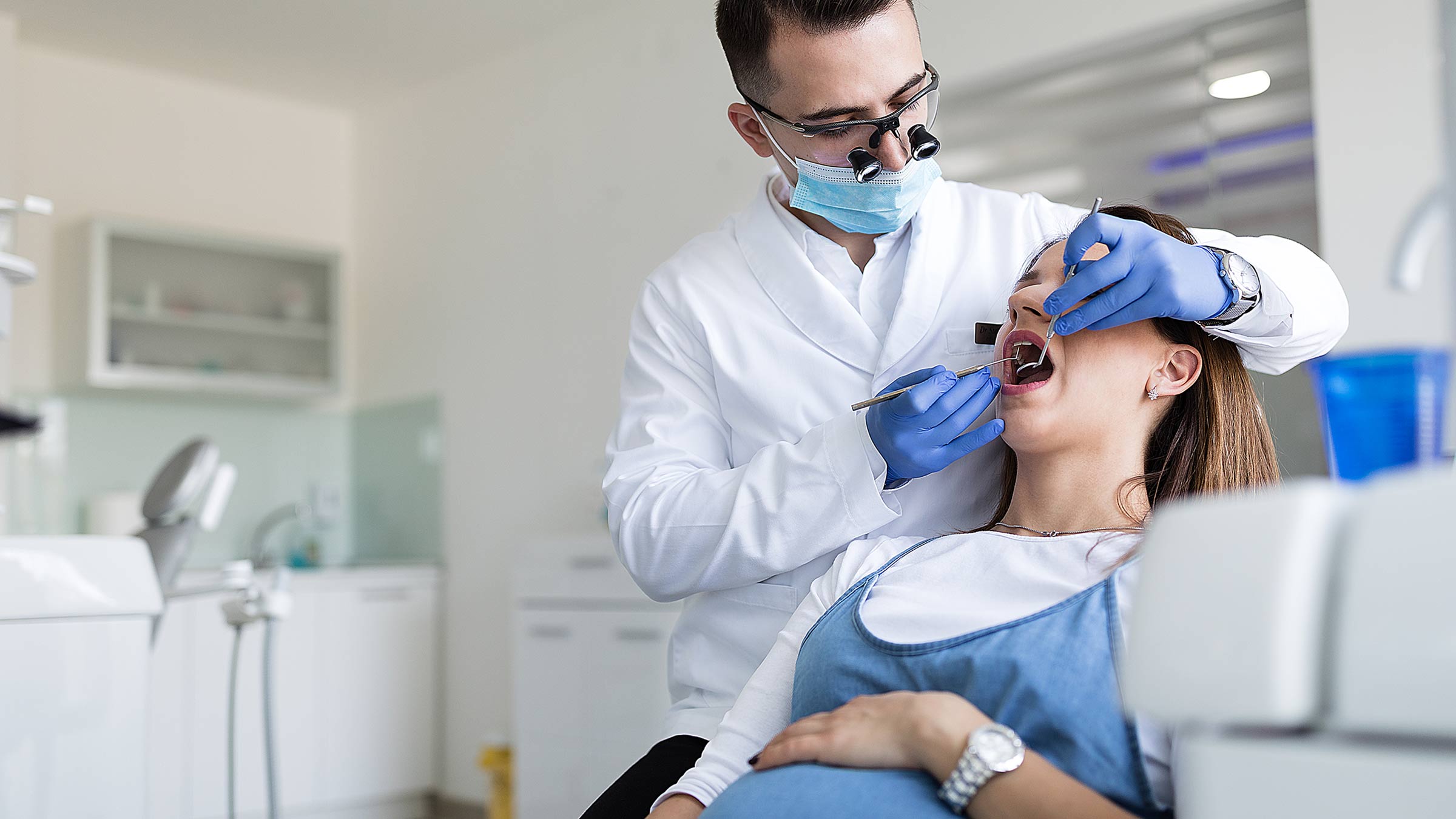 Pregnant woman being examined by a dentist