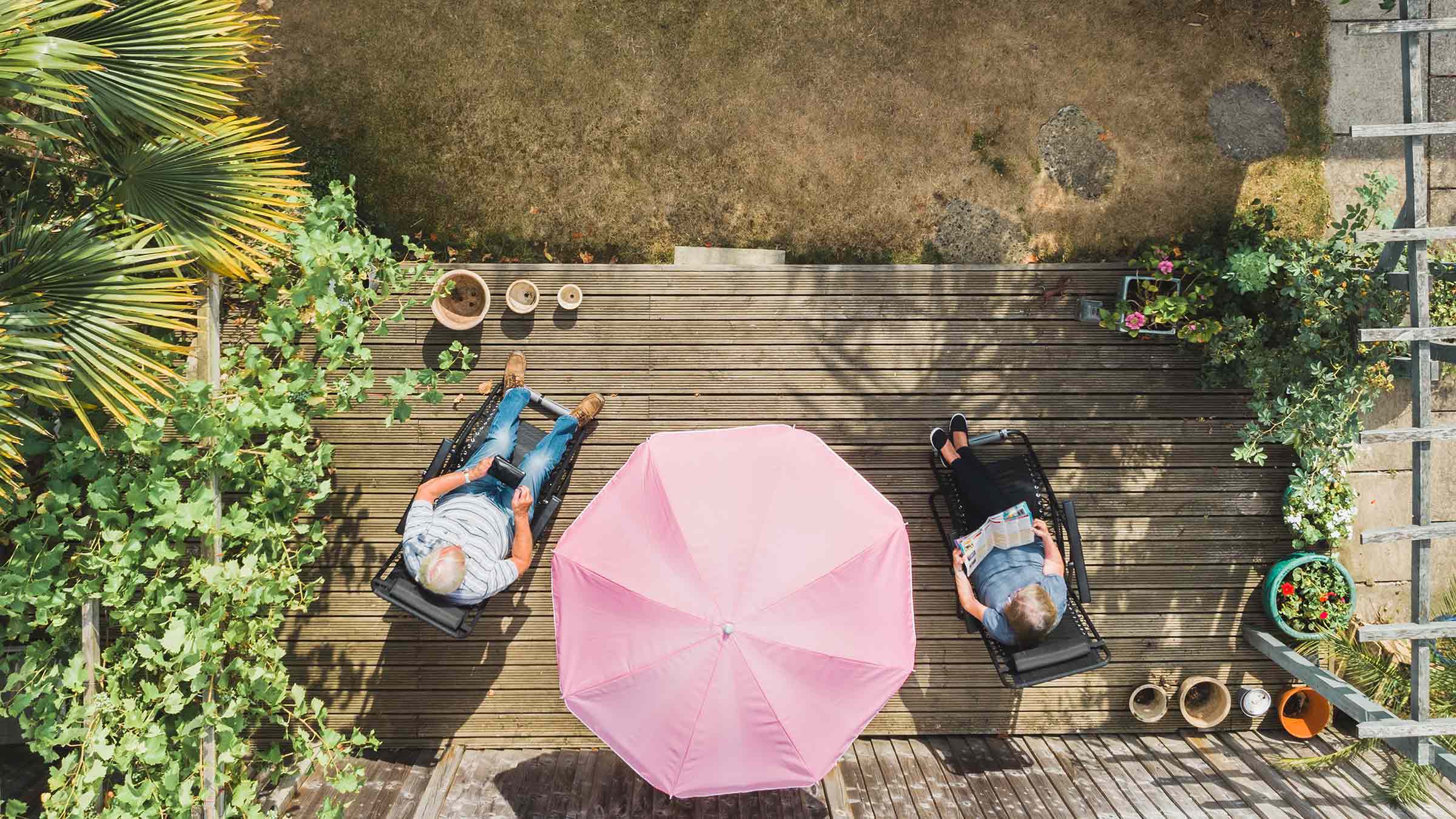A couple relaxing in a suburban garden