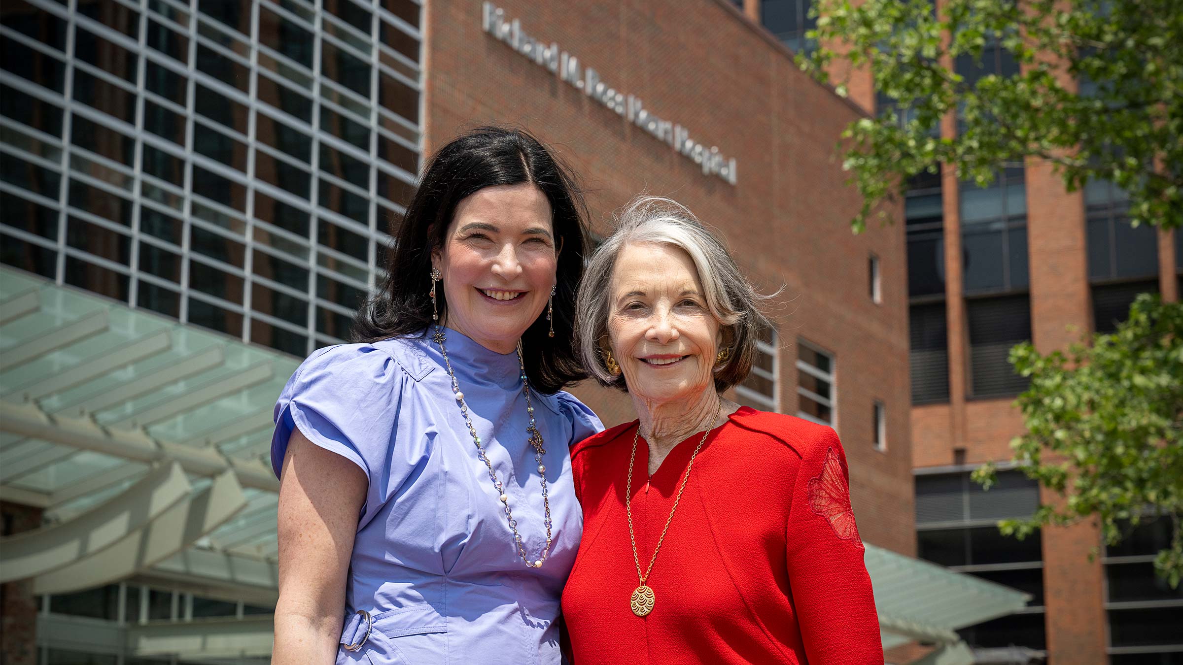 Sarah Kay and Sarah “Sally” Ross Soter standing in front of Ohio State's Ross Heart Hospital