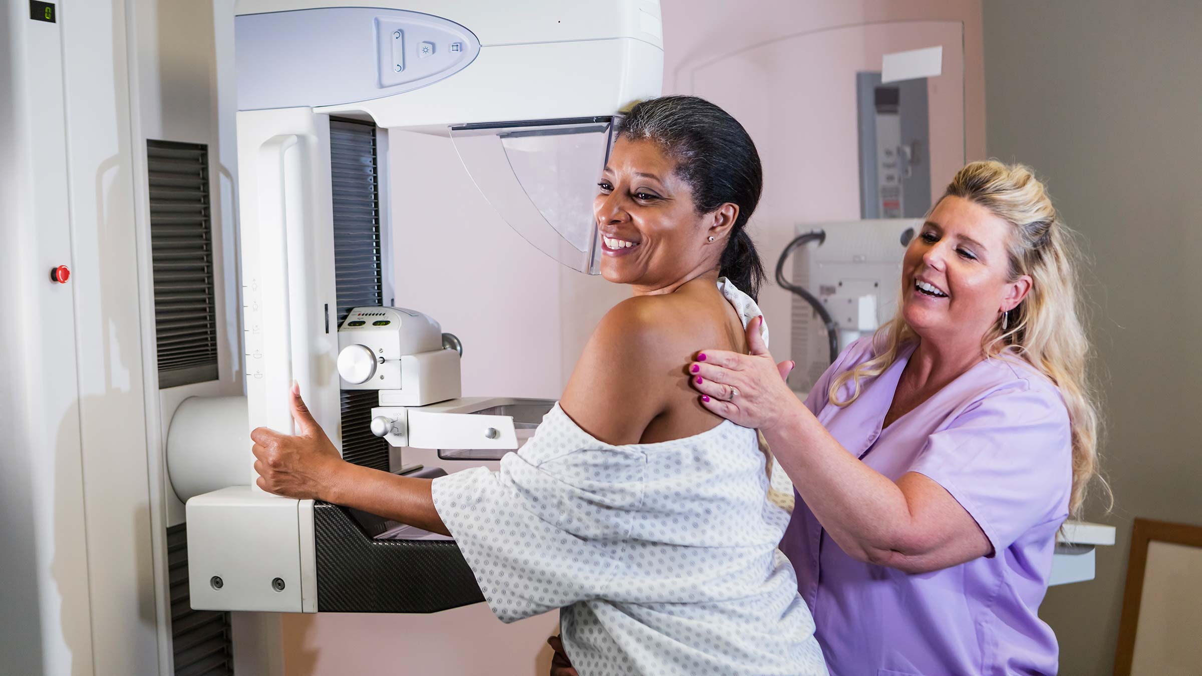 A woman getting a mammogram