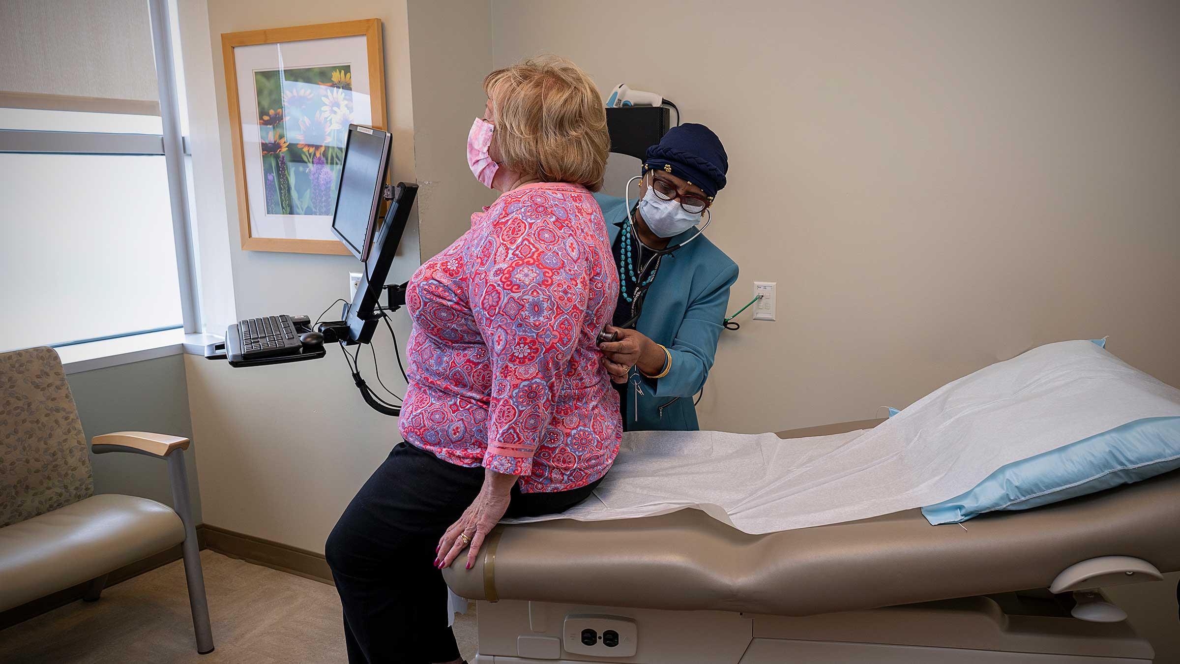 Dr. Ramaswamy examining a patient