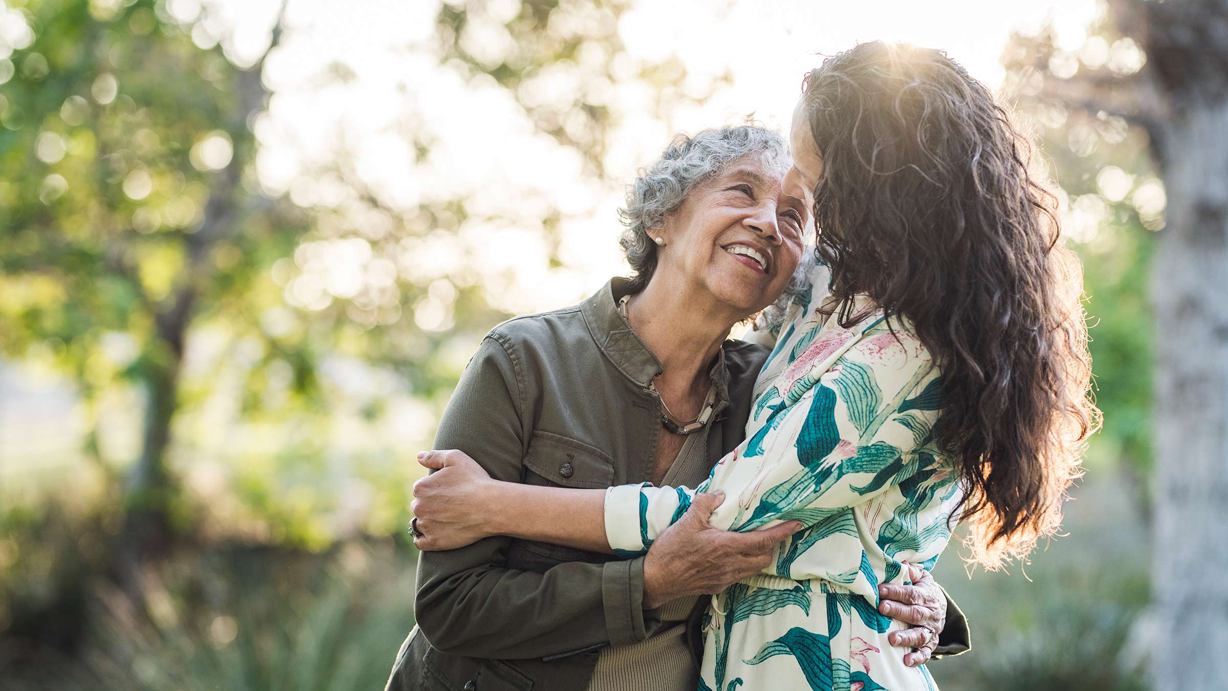 A woman hugging her elderly mother