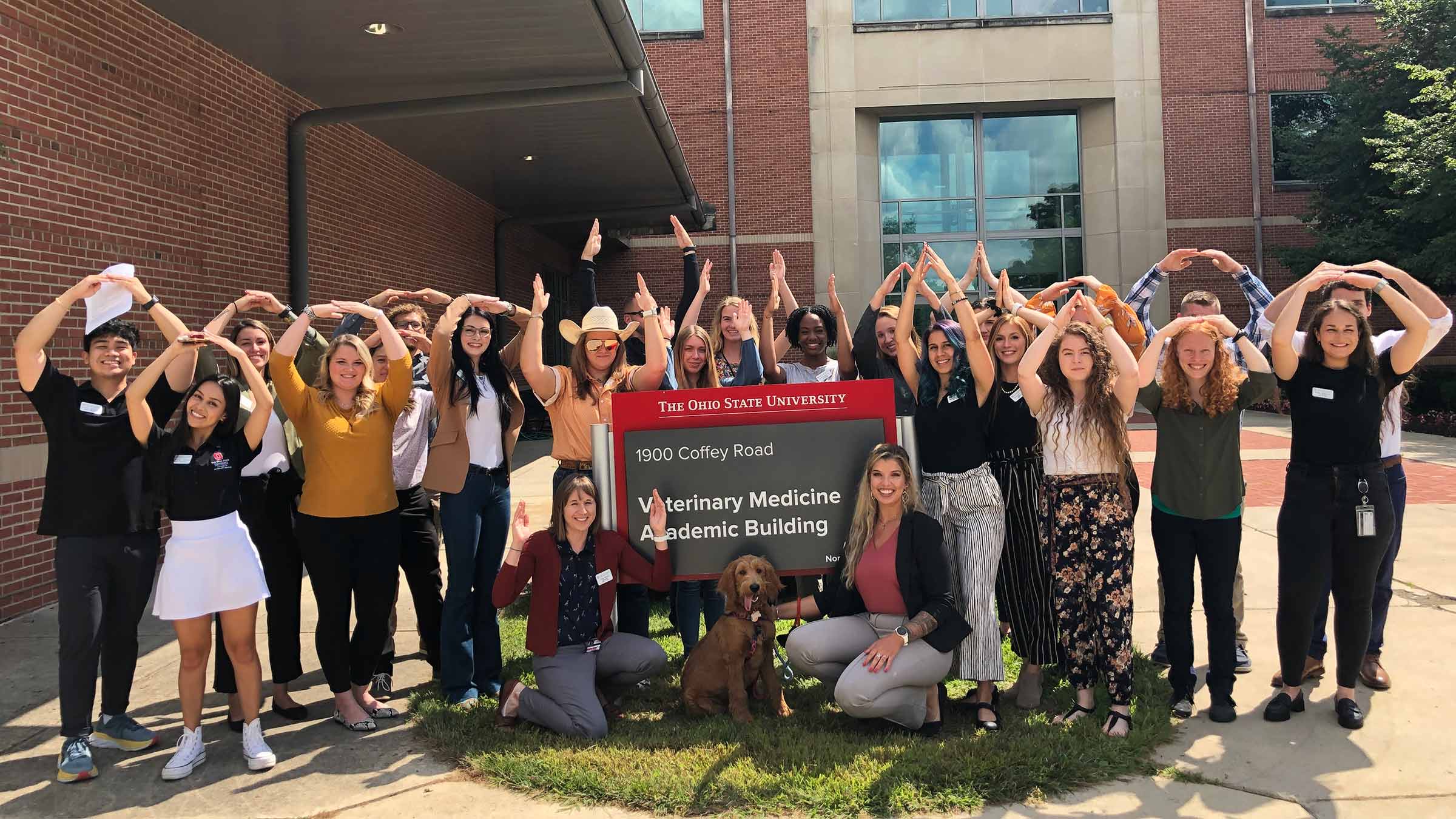 Group of students at the College of Veterinary Medicine building