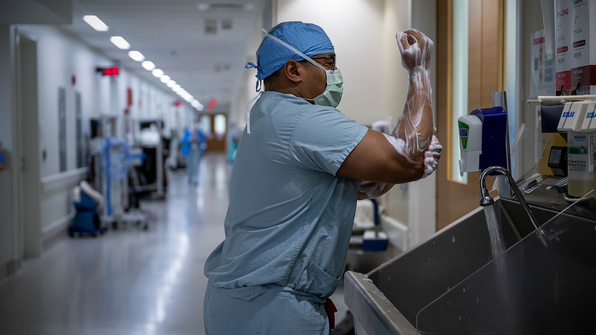 Dr. Merritt scrubbing in preparing for the surgery