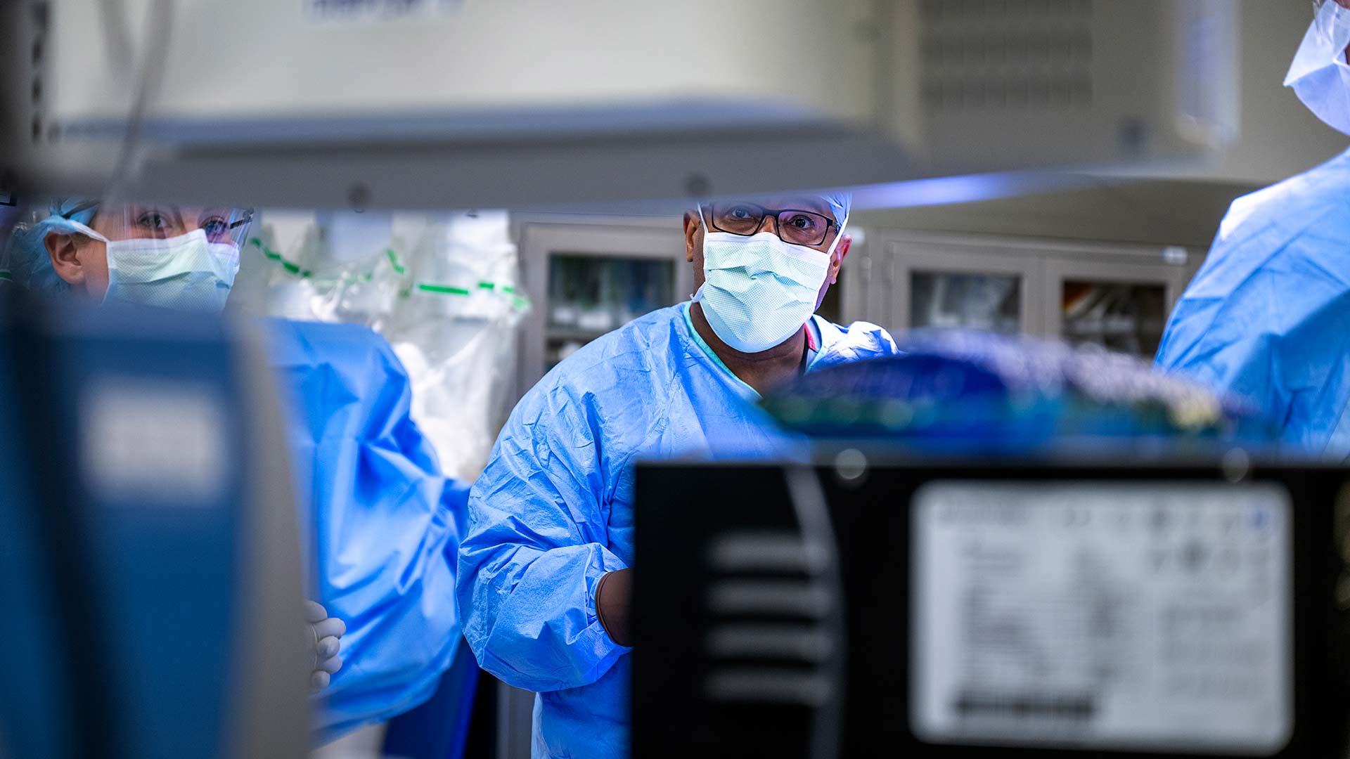 Dr. Merritt in the operating room looking at the screen